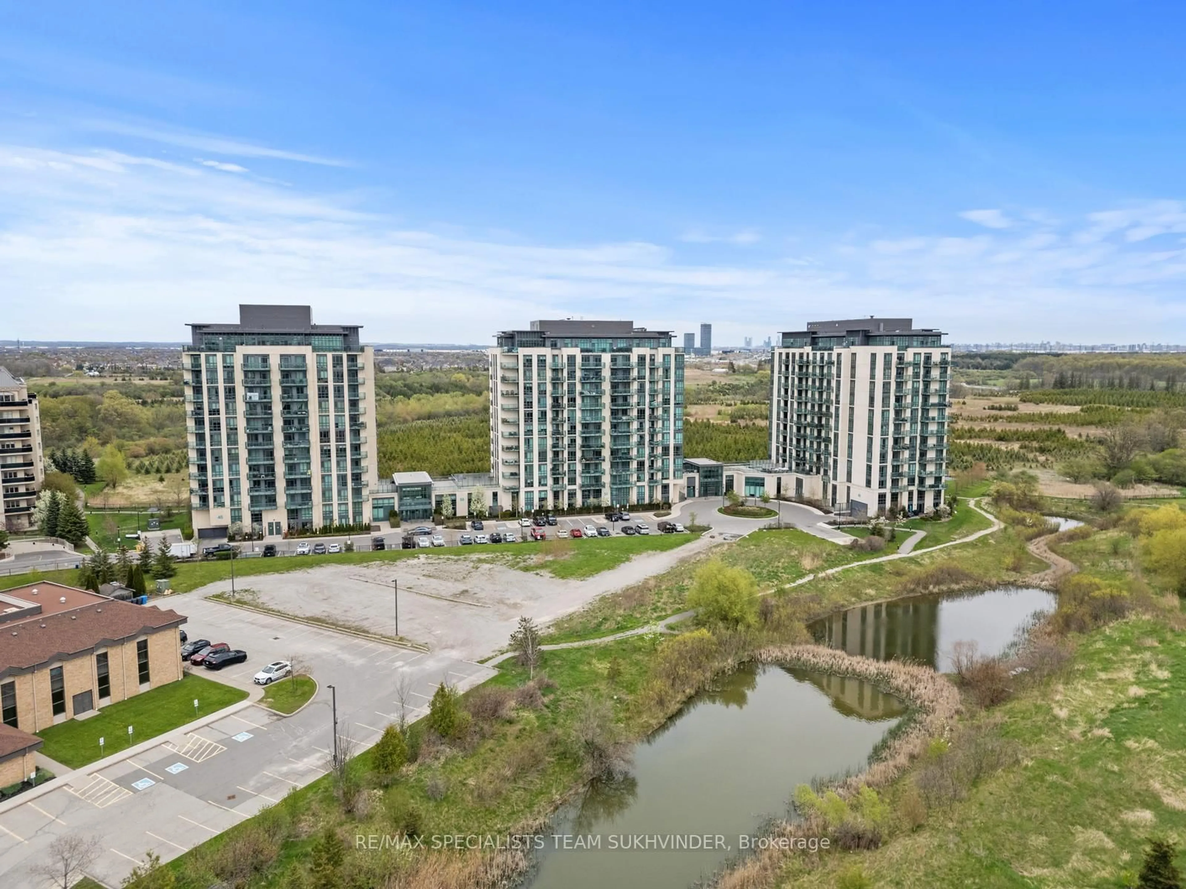 A pic from outside/outdoor area/front of a property/back of a property/a pic from drone, water/lake/river/ocean view for 55 Yorkland Blvd #107, Brampton Ontario L6P 4K9