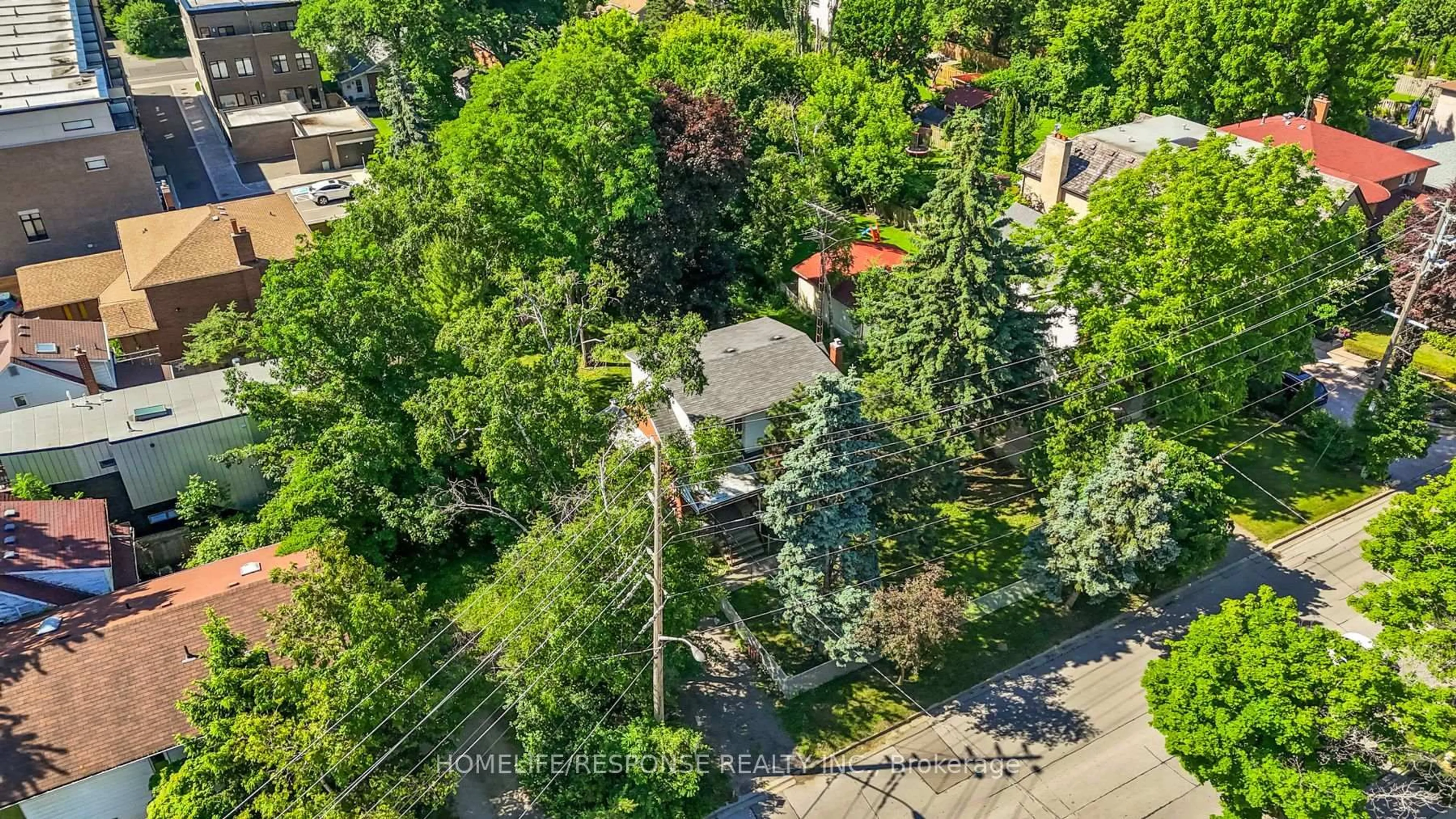 A pic from outside/outdoor area/front of a property/back of a property/a pic from drone, street for 211 Bering Ave, Toronto Ontario M8Z 3A4
