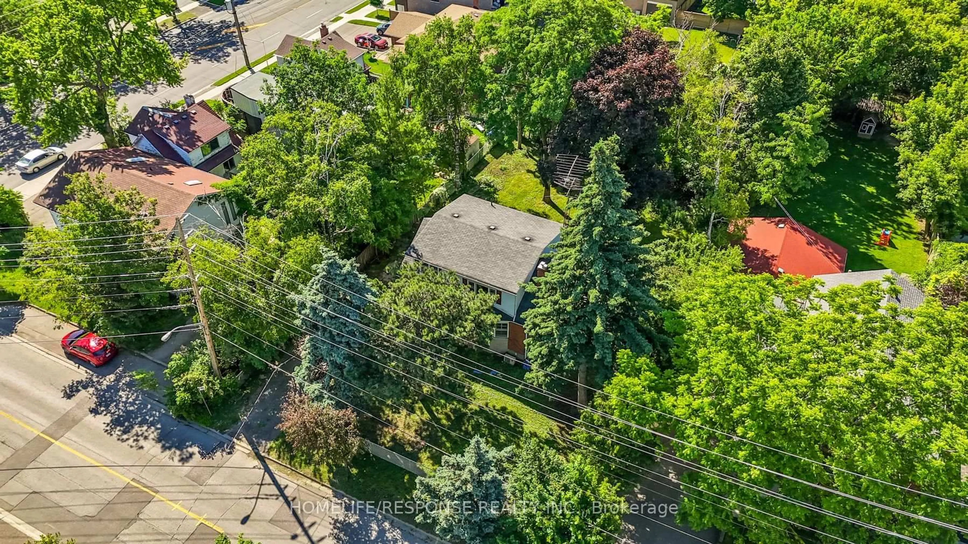 A pic from outside/outdoor area/front of a property/back of a property/a pic from drone, street for 211 Bering Ave, Toronto Ontario M8Z 3A4