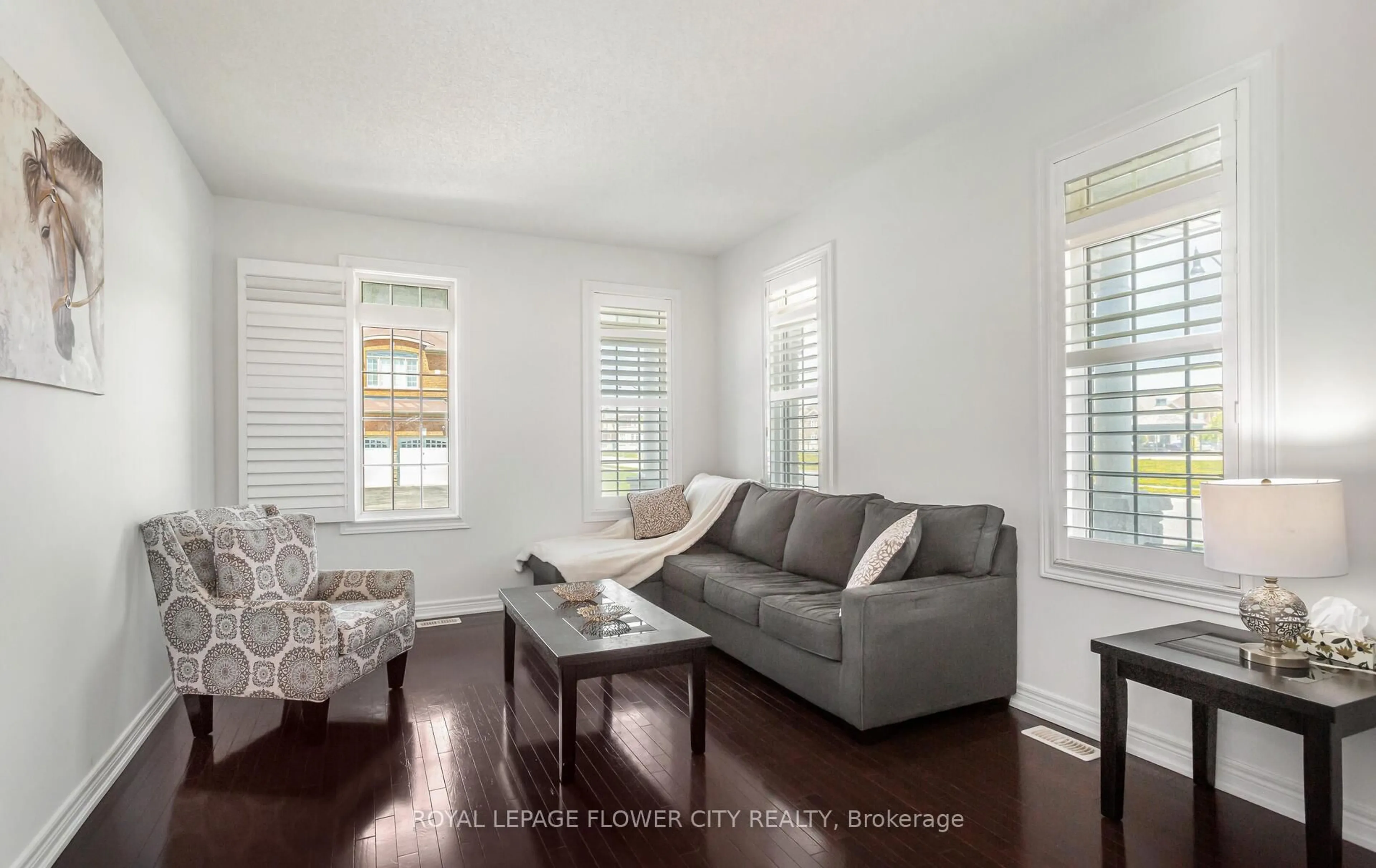 Living room with furniture, wood/laminate floor for 28 DRUMMONDVILLE Dr, Brampton Ontario L6P 3M9