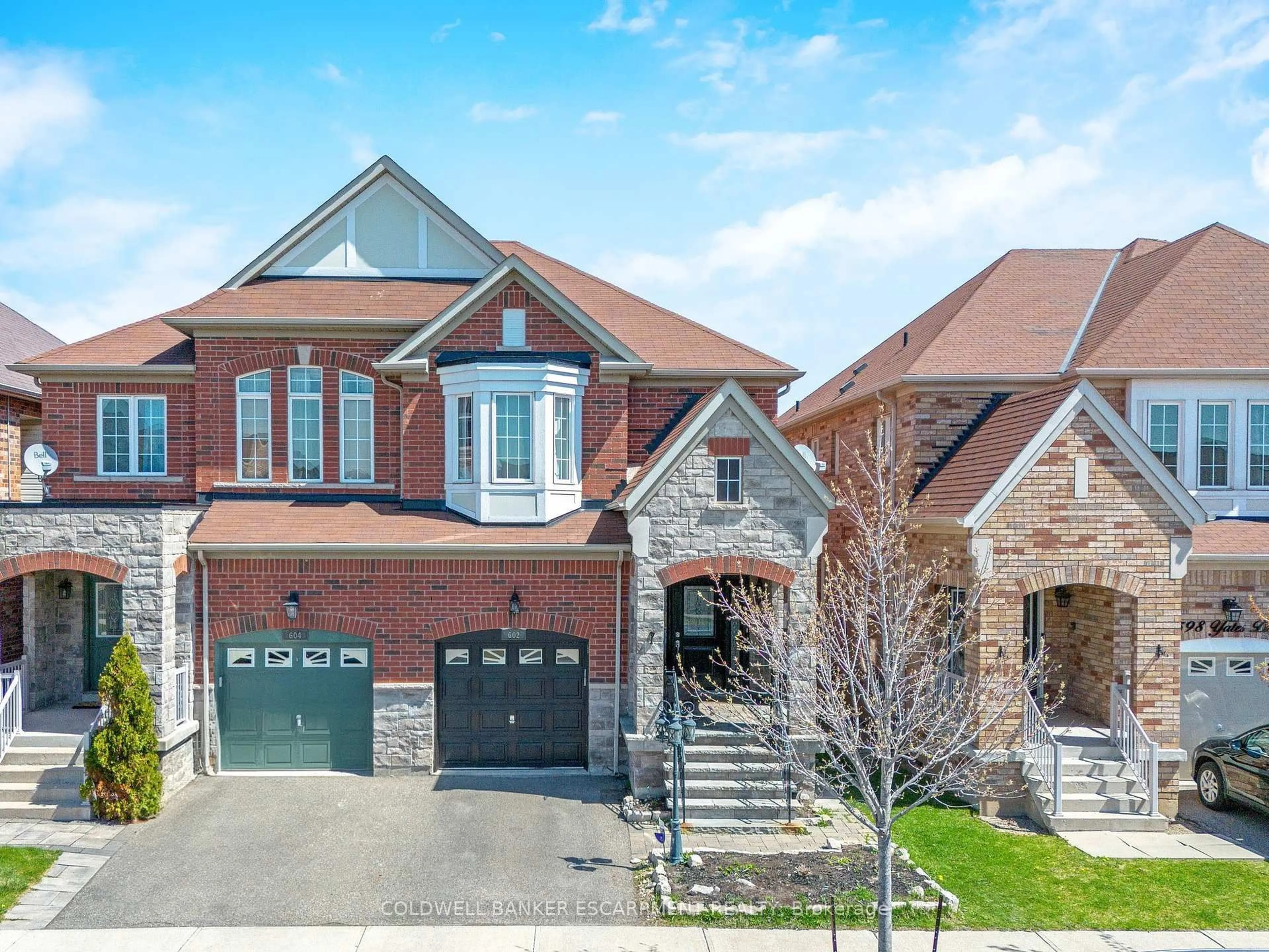 Home with brick exterior material, street for 602 Yates Dr, Milton Ontario L9T 7R1