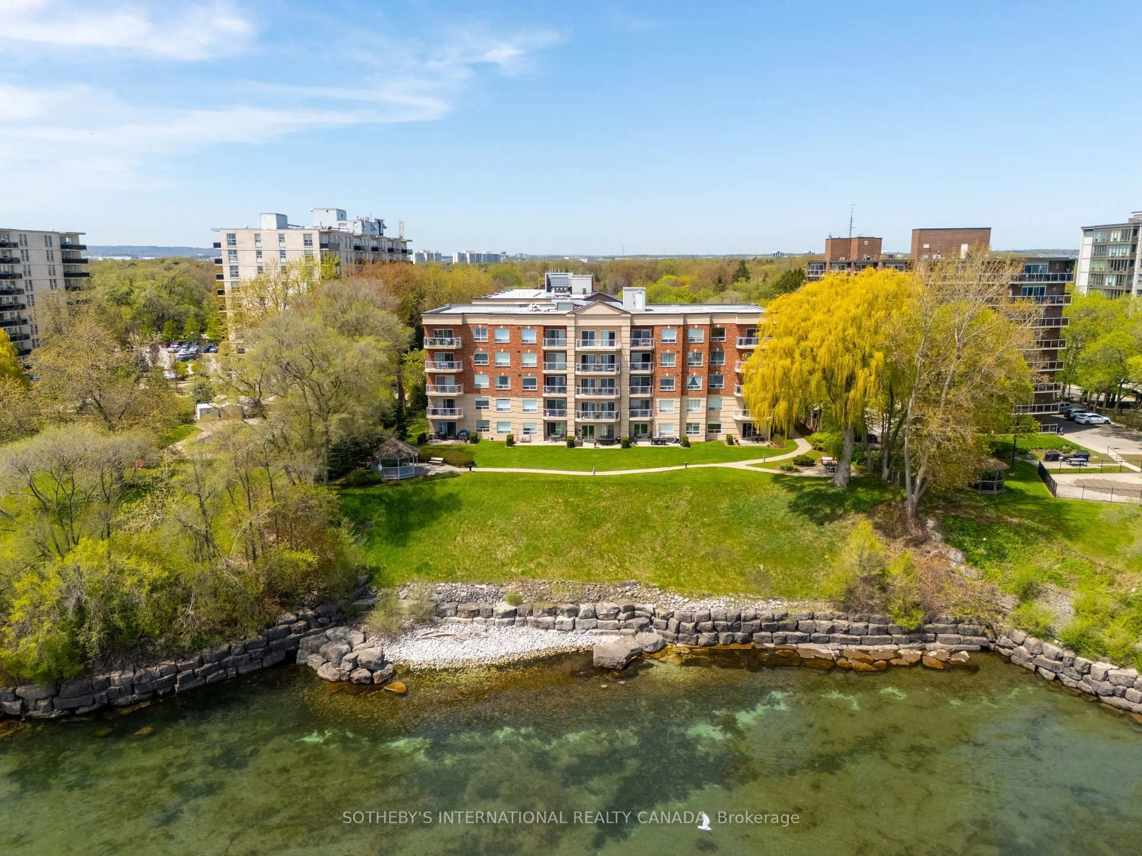 A pic from outside/outdoor area/front of a property/back of a property/a pic from drone, water/lake/river/ocean view for 5194 Lakeshore Rd #102, Burlington Ontario L7L 6P5