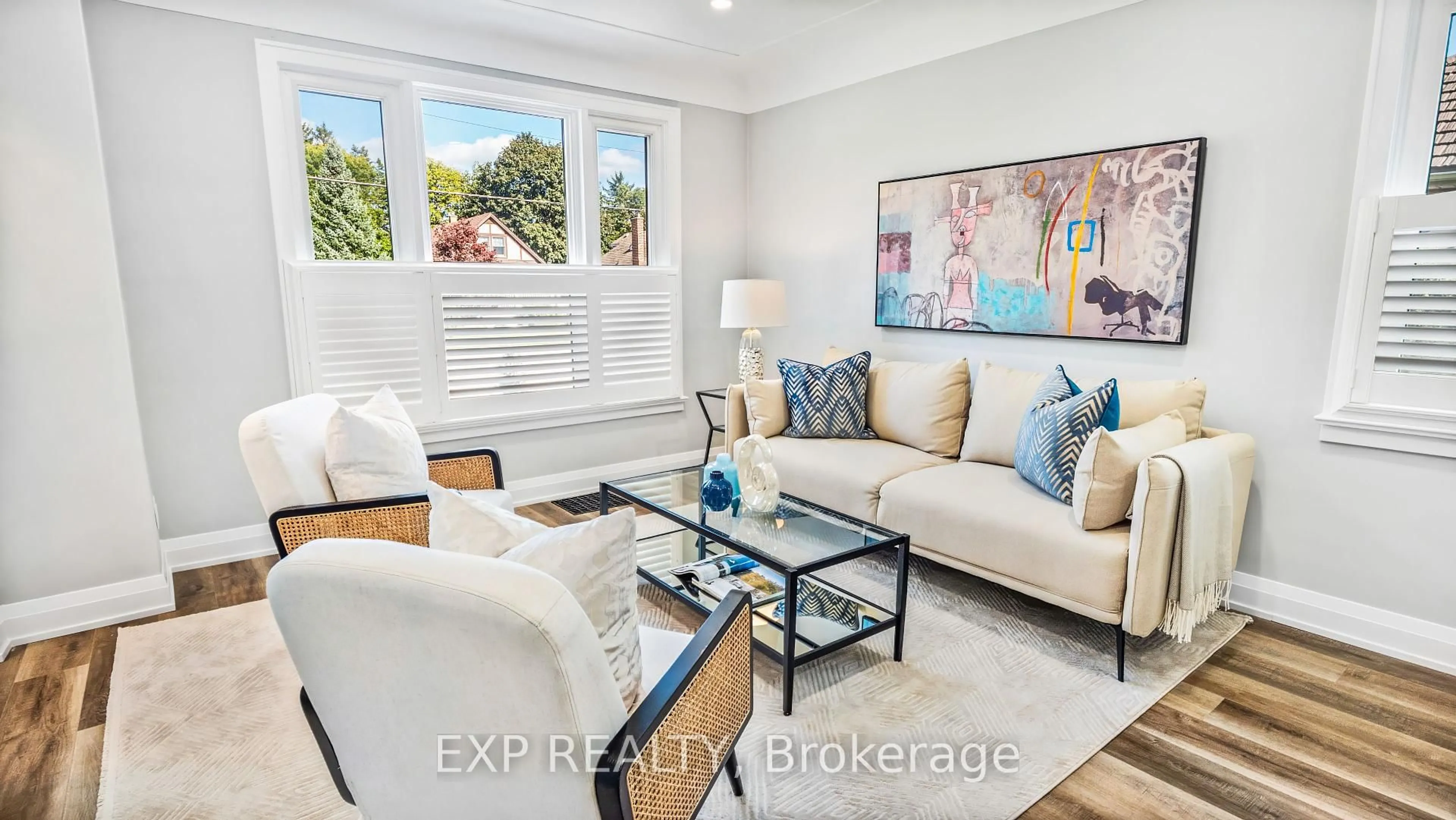 Living room with furniture, wood/laminate floor for 1036 Cedarwood Pl, Burlington Ontario L7T 3J3
