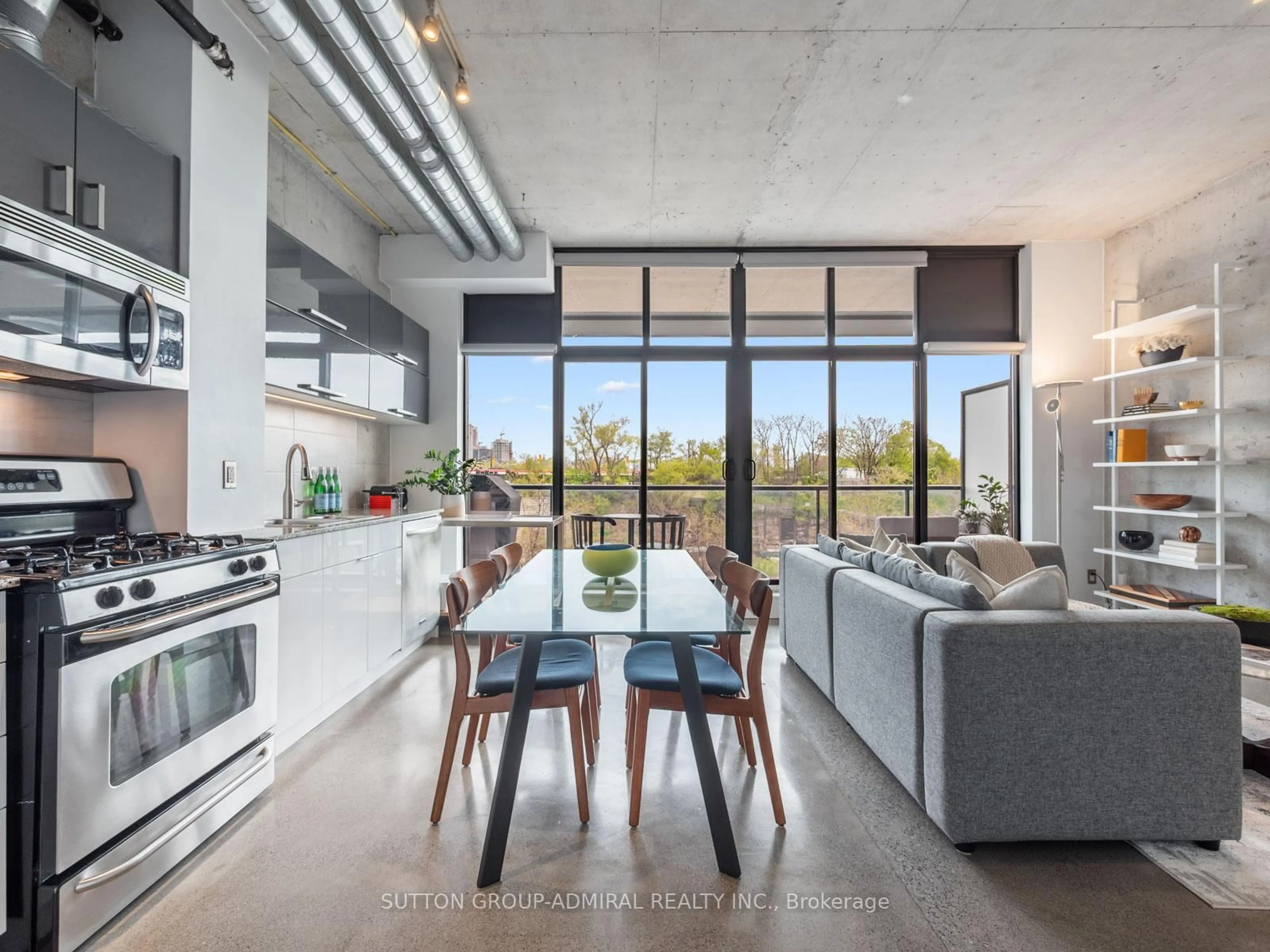 Open concept kitchen, cement floor for 369 Sorauren Ave #307, Toronto Ontario M6R 3C2