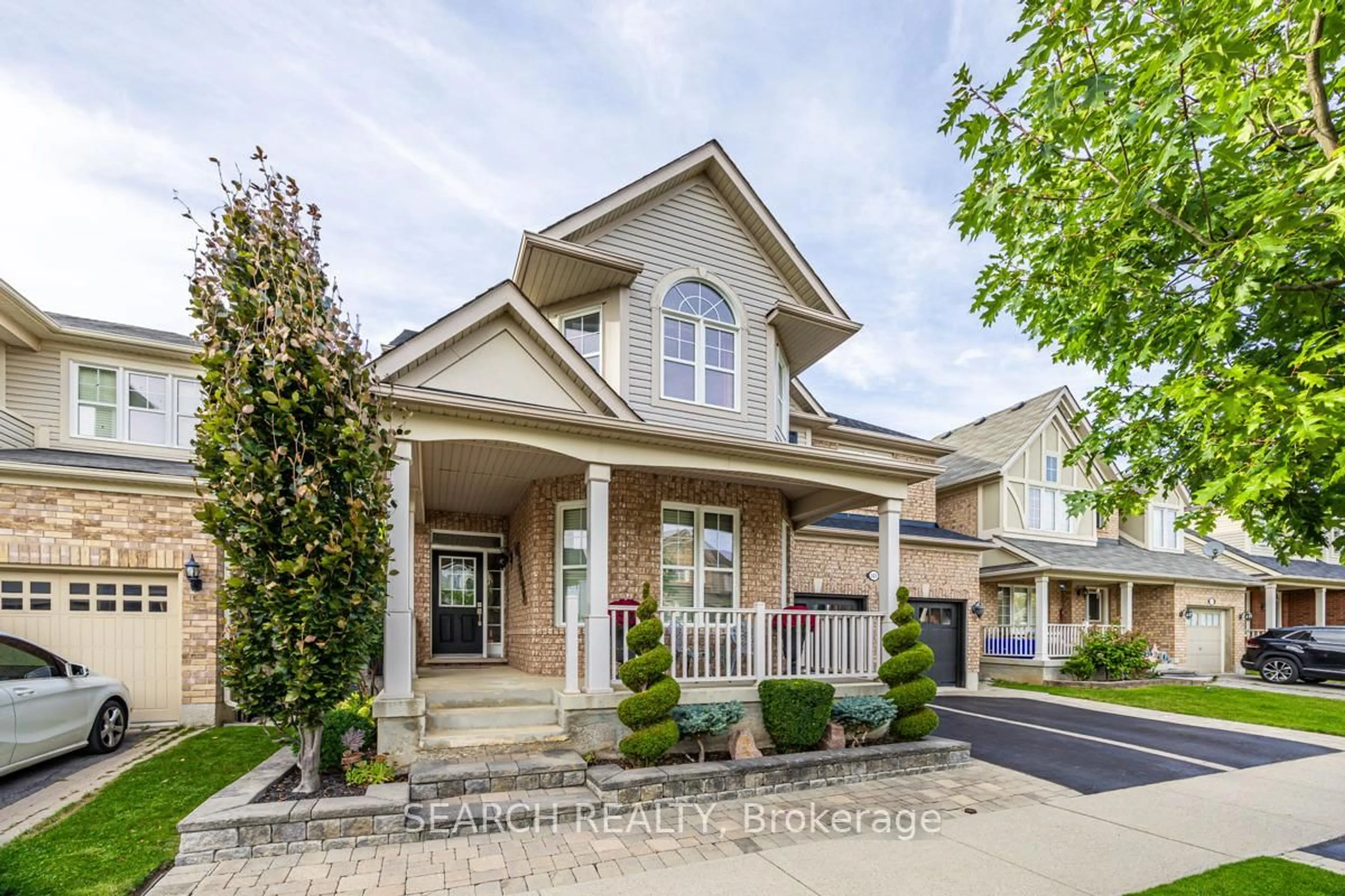 Home with brick exterior material, street for 323 McDougall Crossing, Milton Ontario L9T 0N5