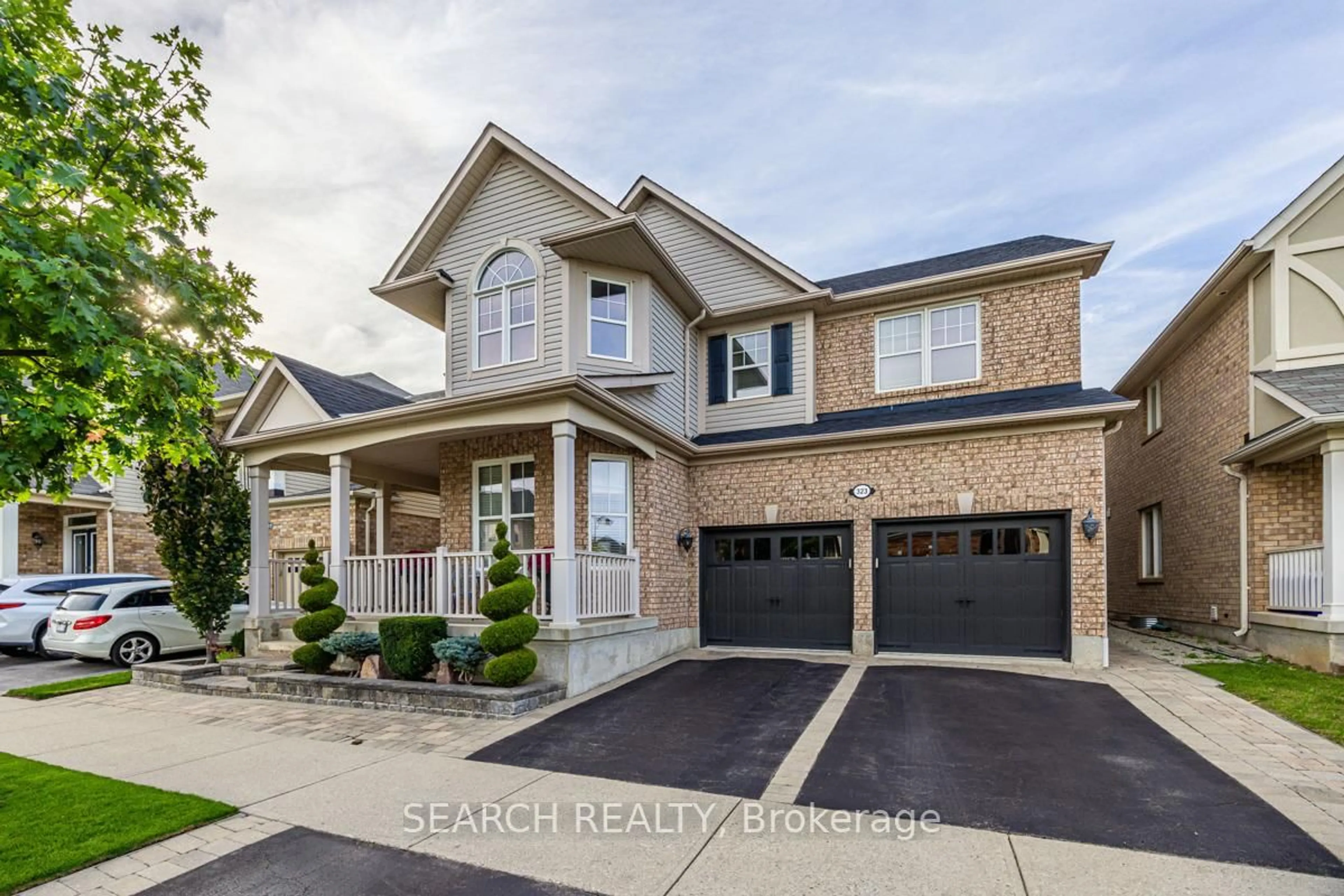 Home with brick exterior material, street for 323 McDougall Crossing, Milton Ontario L9T 0N5
