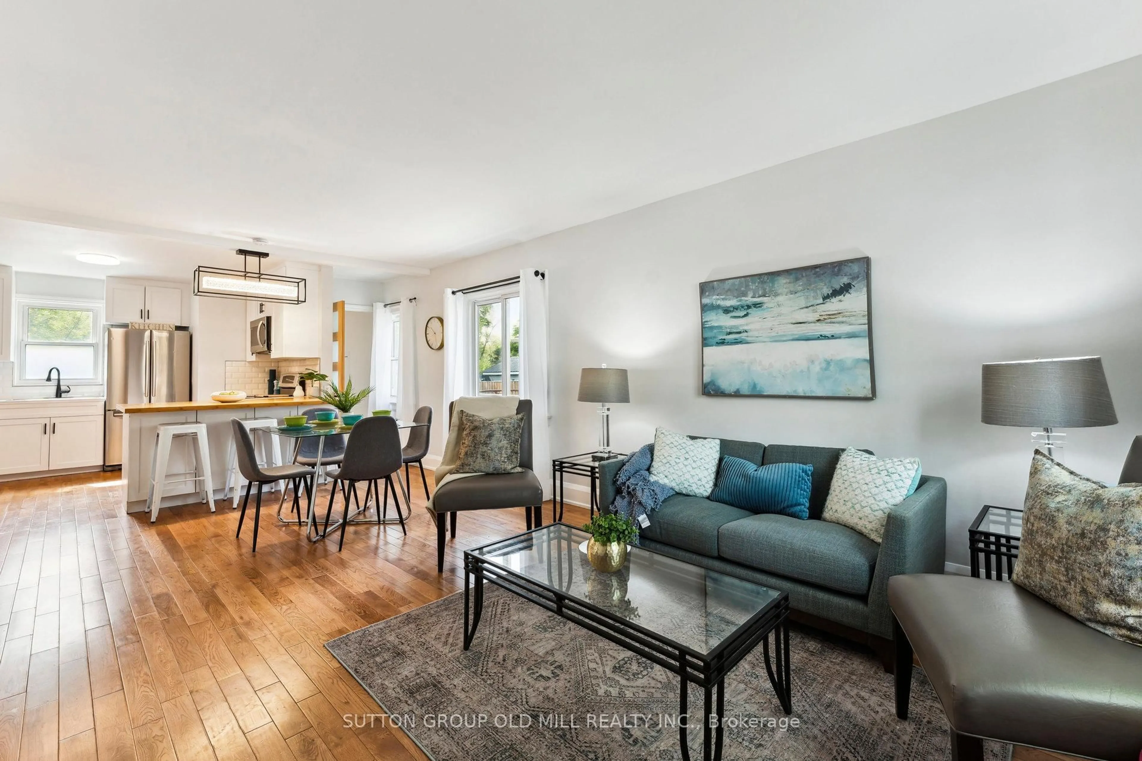 Living room with furniture, wood/laminate floor for 7 Jessie St, Brampton Ontario L6Y 1L3
