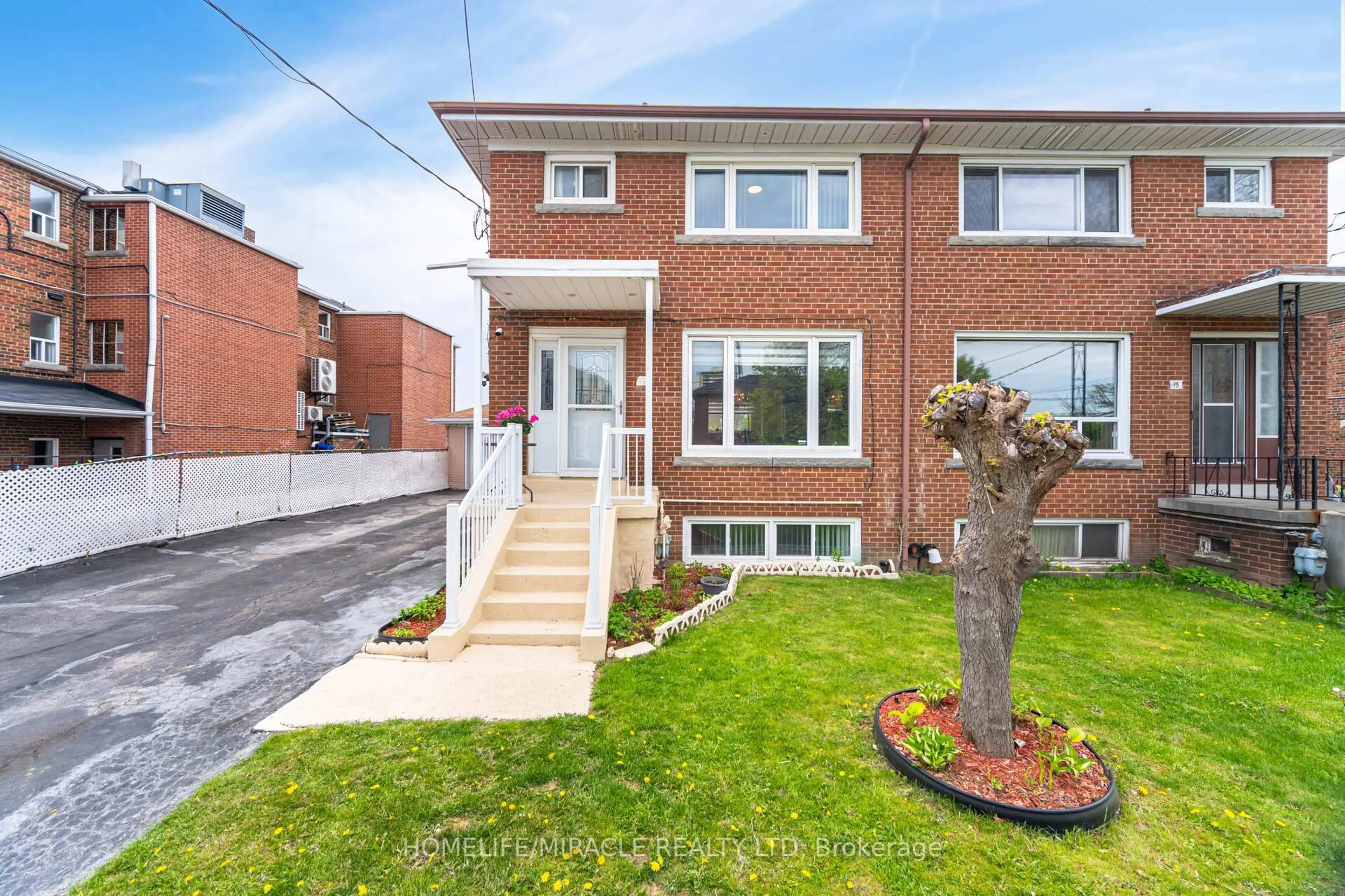 Home with brick exterior material, street for 11 Arrowsmith Ave, Toronto Ontario M6M 2W8