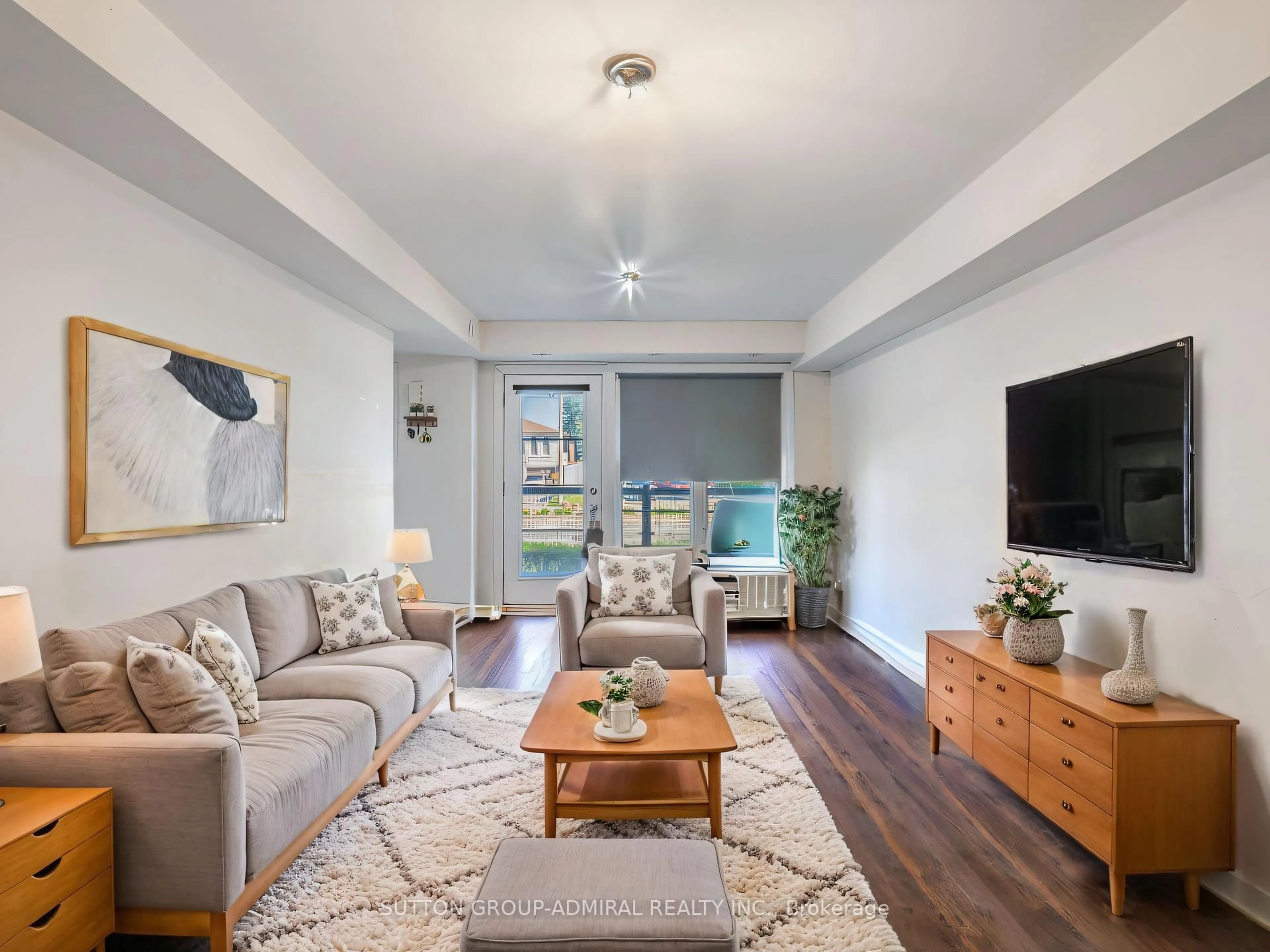 Living room with furniture, wood/laminate floor for 2315 Sheppard Ave #64, Toronto Ontario M9M 0E8