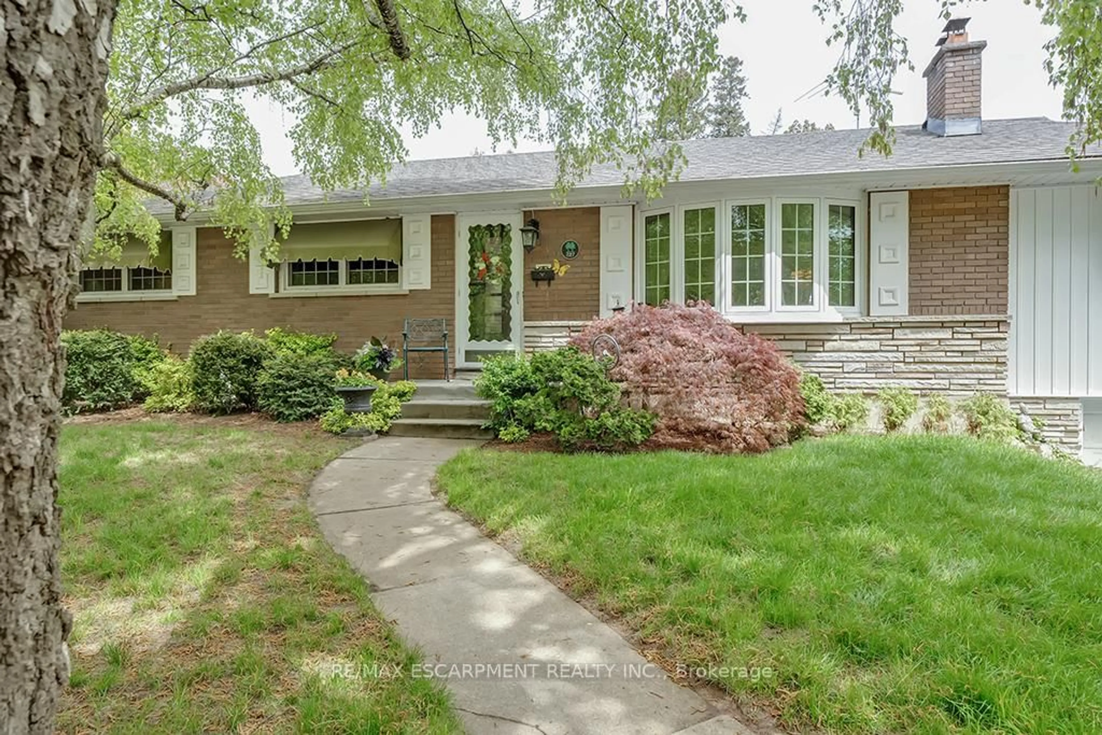 Home with brick exterior material, street for 327 Strathcona Dr, Burlington Ontario L7L 2E2