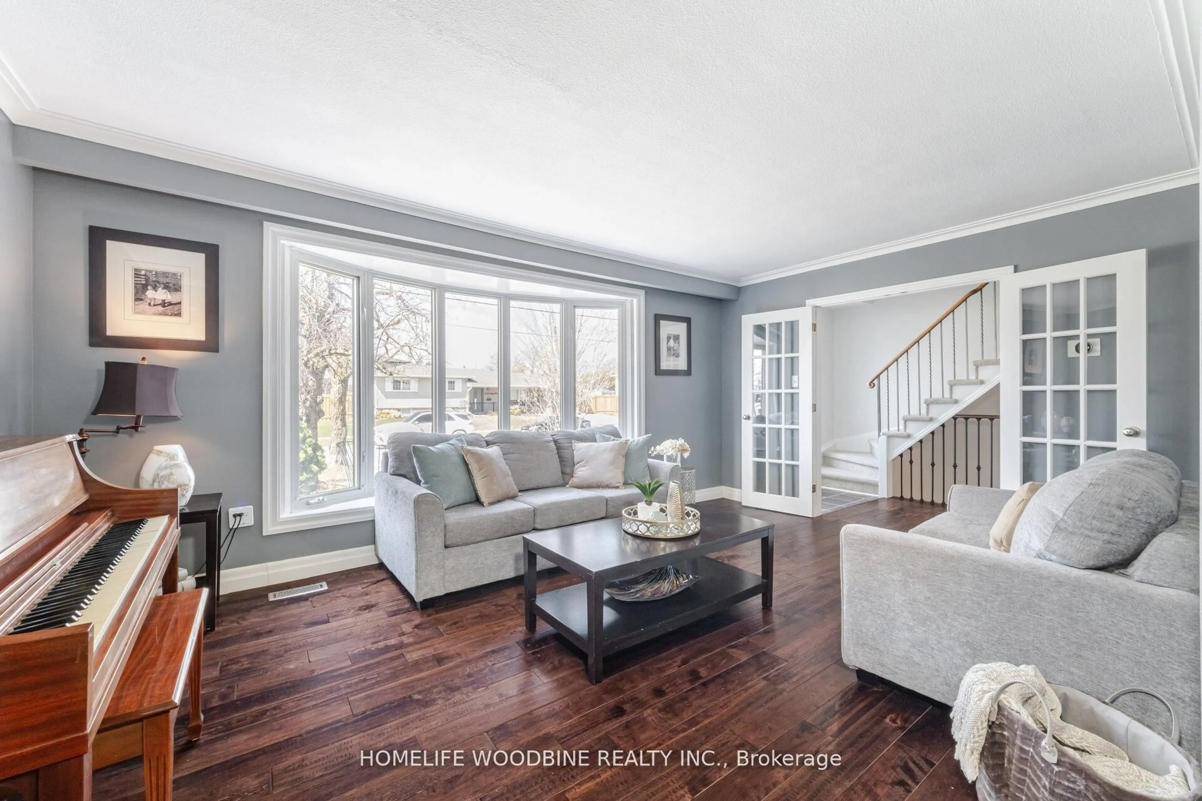 Living room with furniture, wood/laminate floor for 5 Stockman Cres, Halton Hills Ontario L7G 1J5