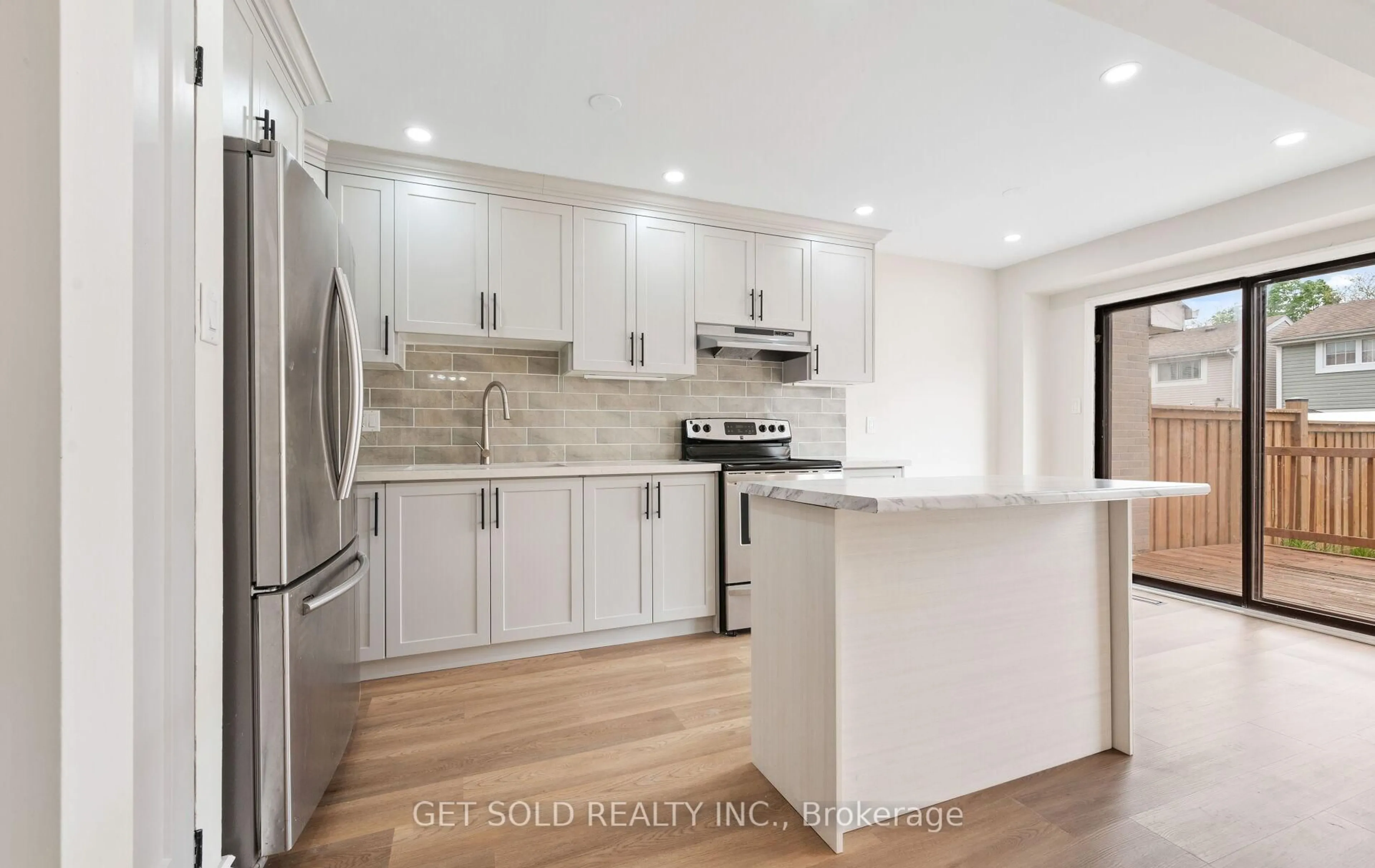 Open concept kitchen, wood/laminate floor for 15 Wray Crt, Toronto Ontario M9V 4K4