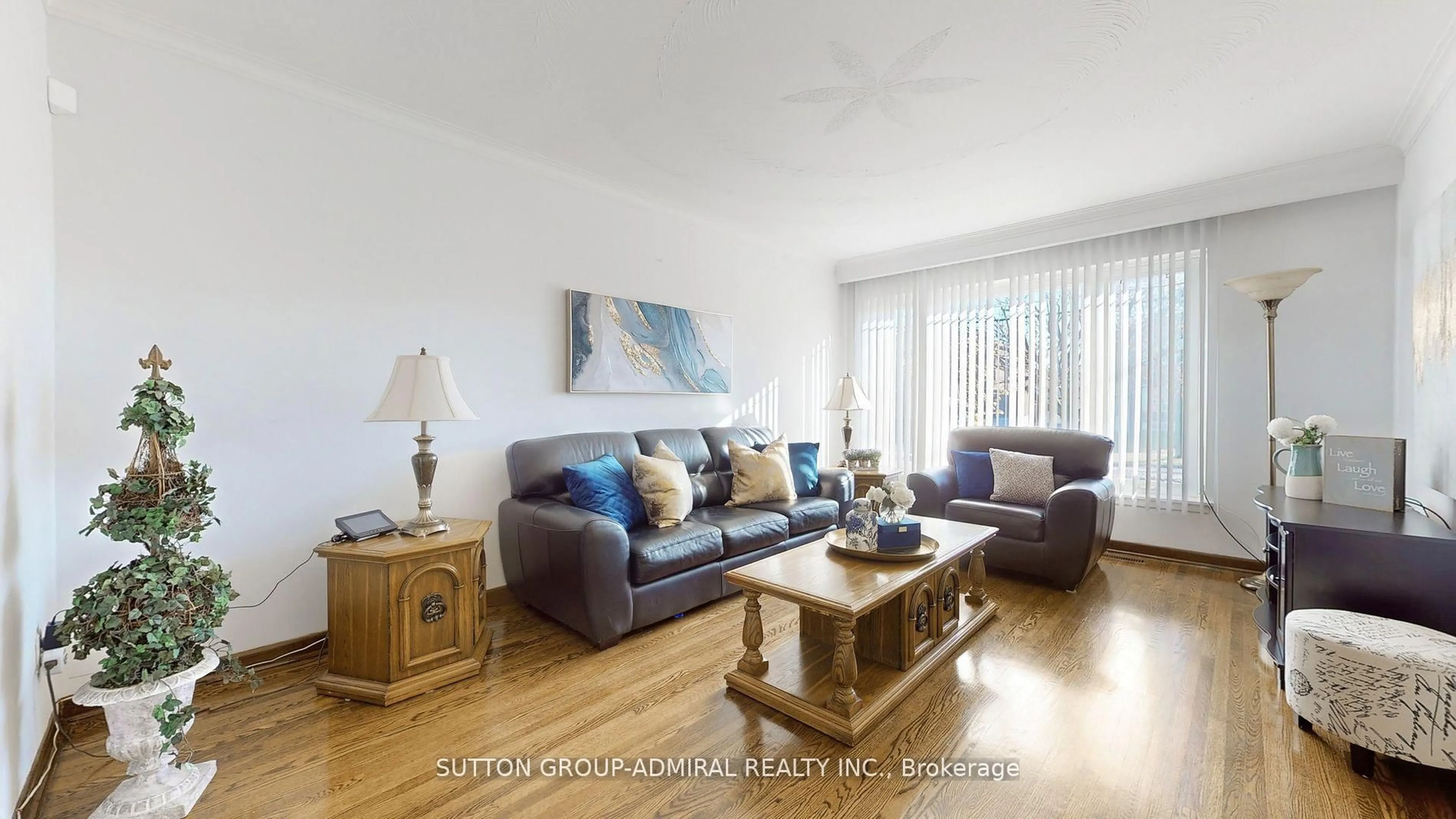 Living room with furniture, wood/laminate floor for 48 Dubray Ave, Toronto Ontario M3K 1V5