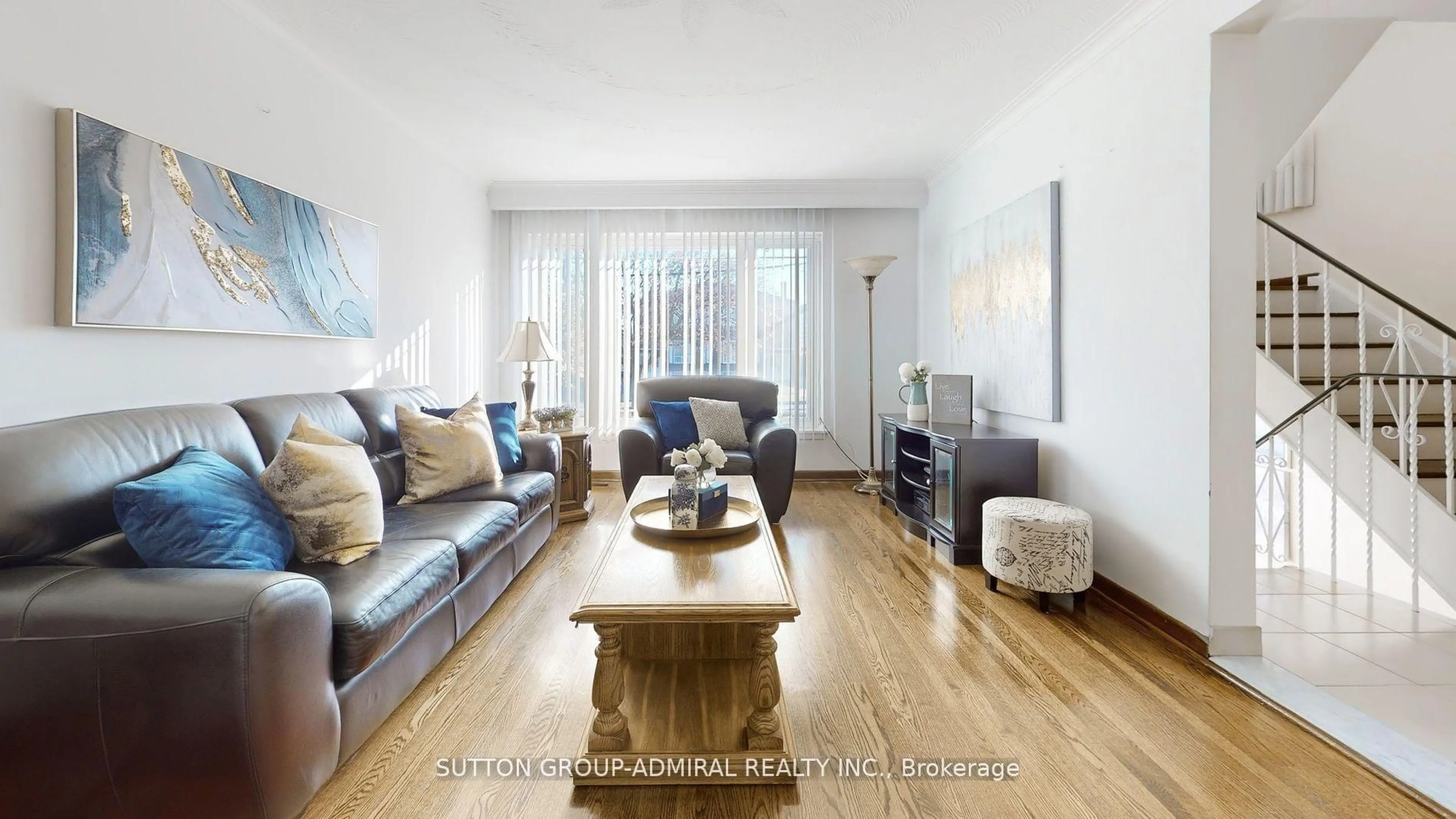 Living room with furniture, wood/laminate floor for 48 Dubray Ave, Toronto Ontario M3K 1V5