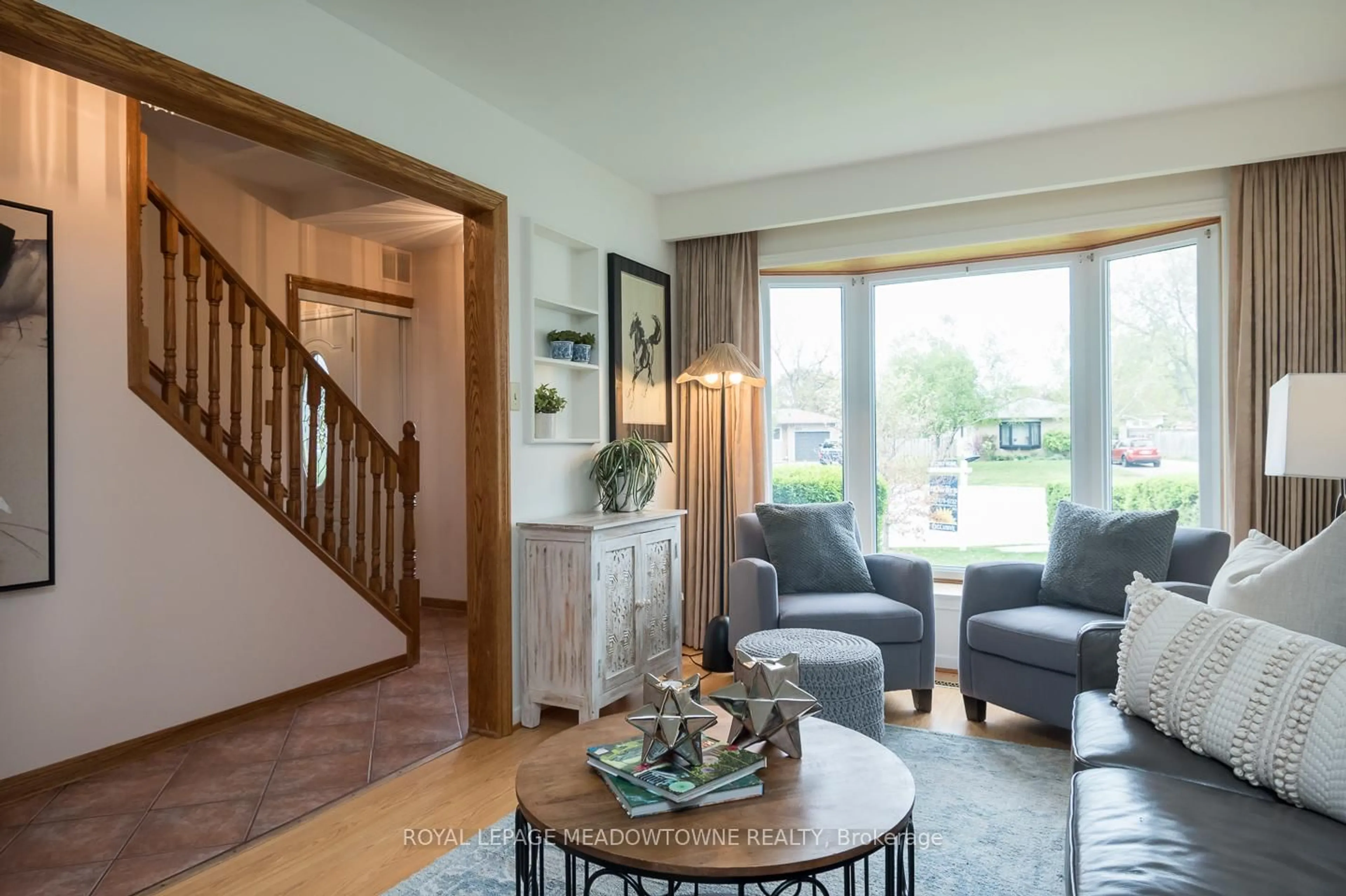 Living room with furniture, wood/laminate floor for 852 Edison Crt, Milton Ontario L9T 3W1