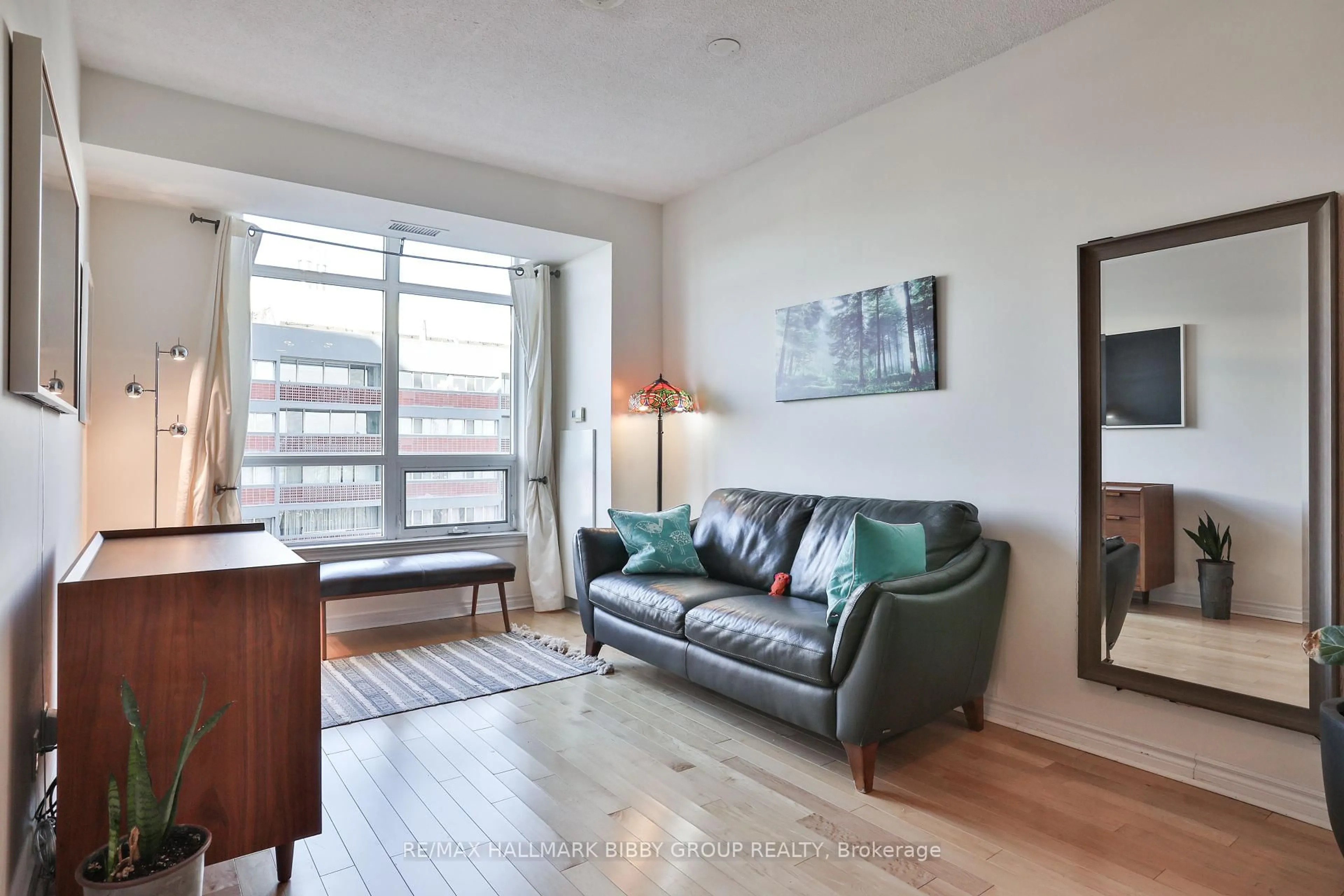 Living room with furniture, wood/laminate floor for 1135 Royal York Rd #814, Toronto Ontario M9A 0C3