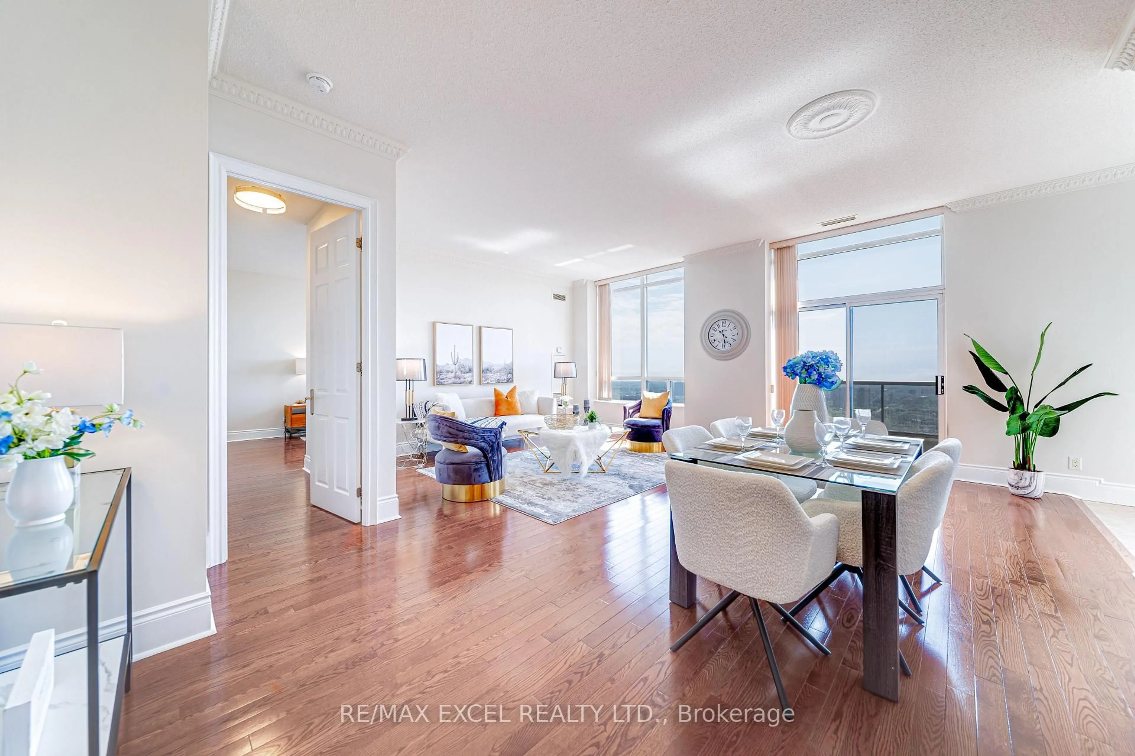 Living room with furniture, wood/laminate floor for 3880 Duke Of York Blvd #GPH9, Mississauga Ontario L5B 4M7