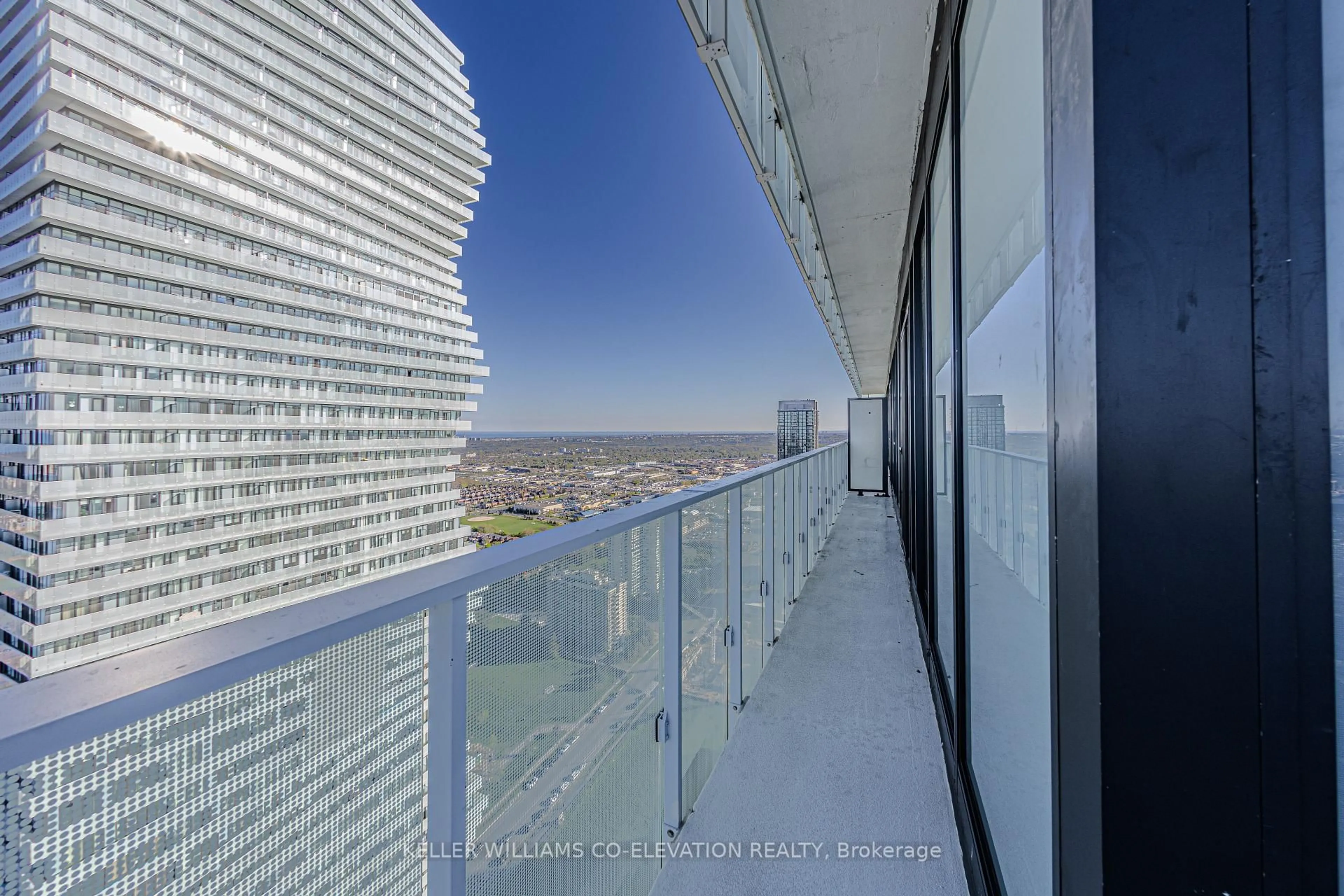 Balcony in the apartment, city buildings view from balcony for 3900 Confederation Pkwy #4203, Mississauga Ontario L5B 0M3