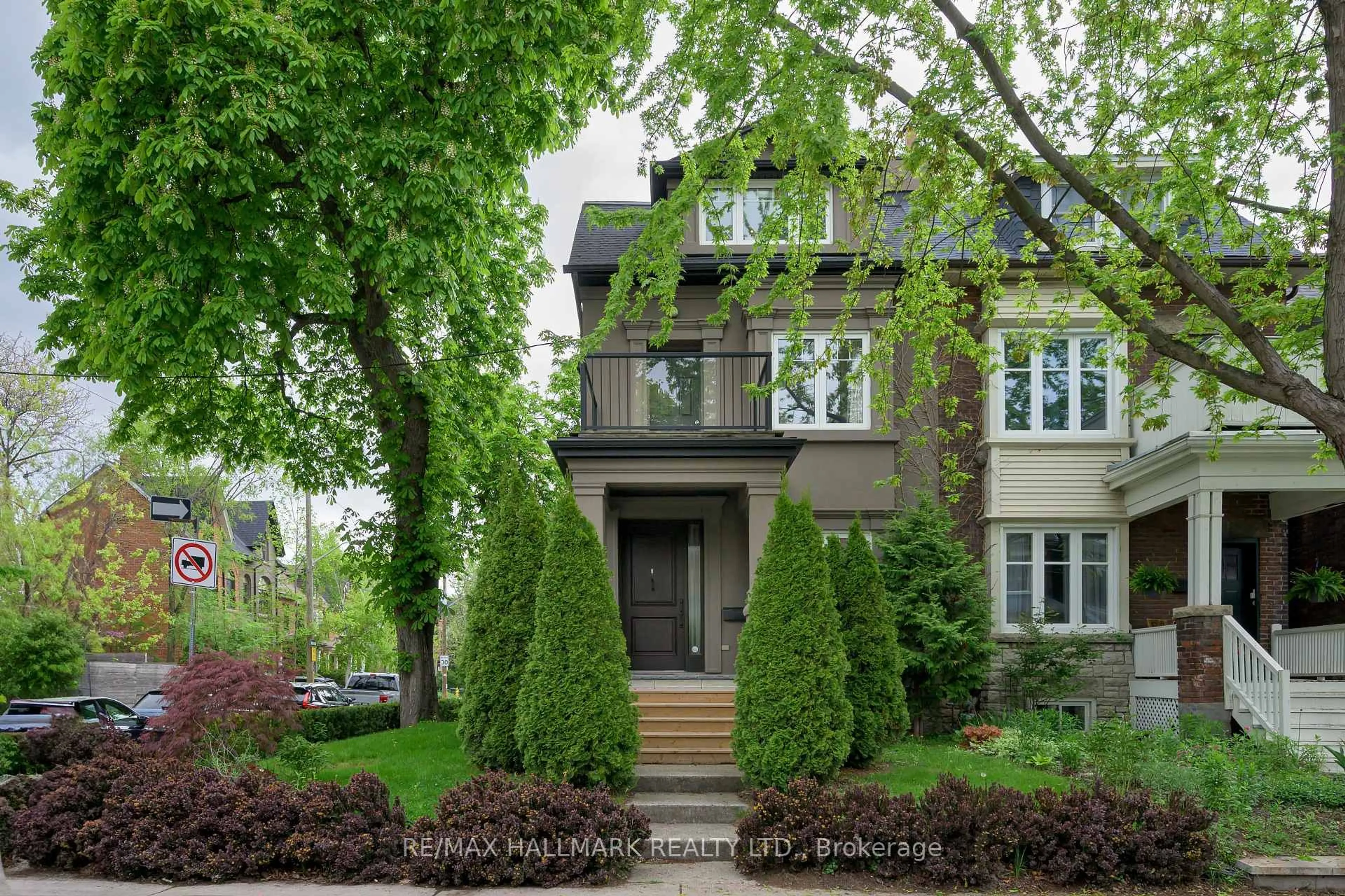 Home with brick exterior material, street for 85 Sorauren Ave, Toronto Ontario M6R 2E1