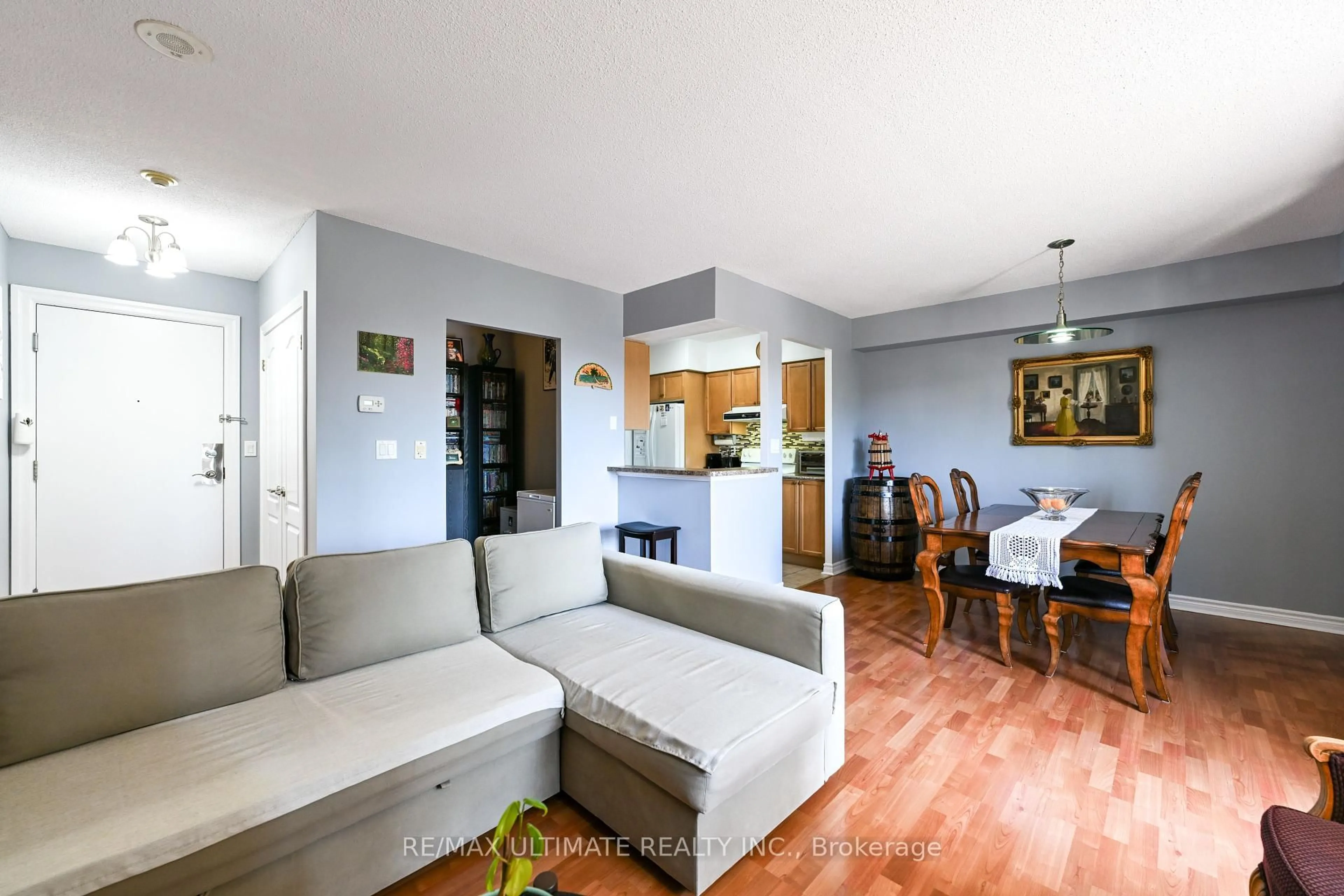 Living room with furniture, wood/laminate floor for 2088 Lawrence Ave #403, Toronto Ontario M9N 3Z9