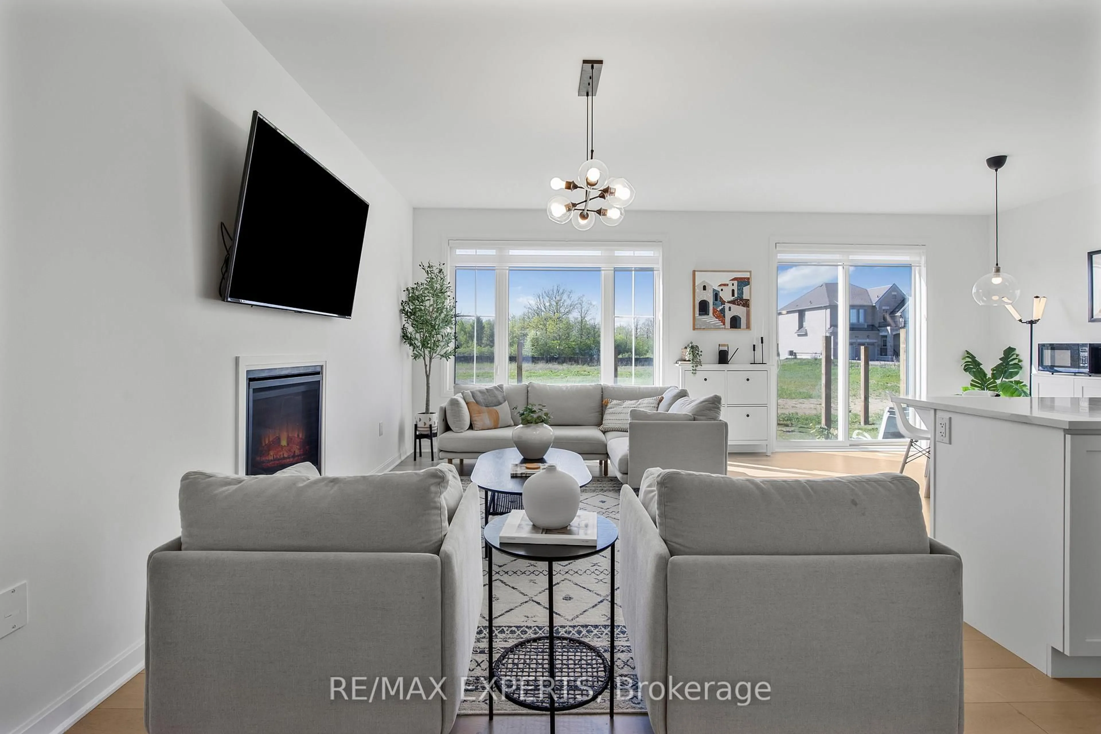 Living room with furniture, ceramic/tile floor for 397 Gordon Krantz Ave, Milton Ontario L9E 1W1
