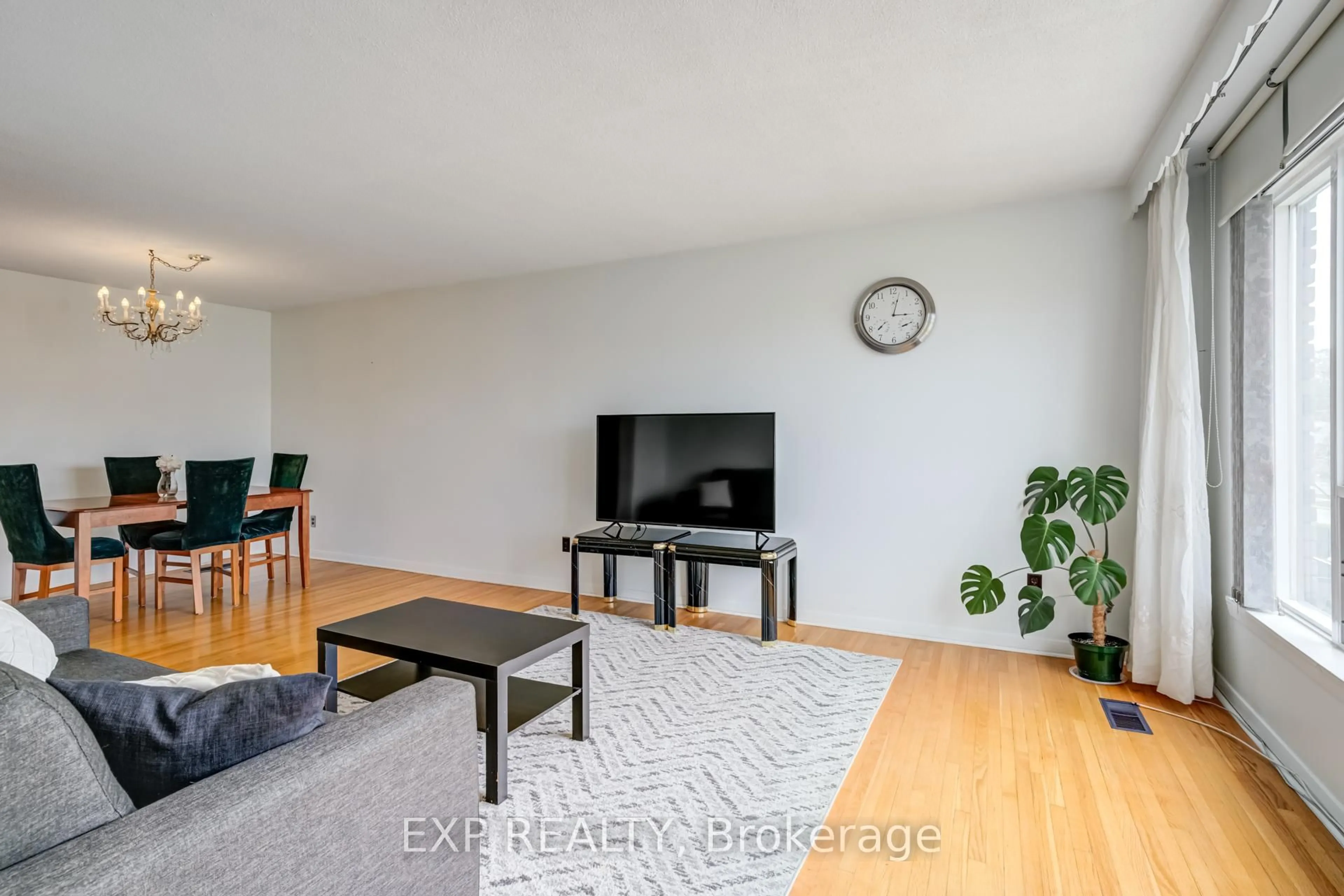 Living room with furniture, wood/laminate floor for 141 Grandravine Dr, Toronto Ontario M3J 1B3
