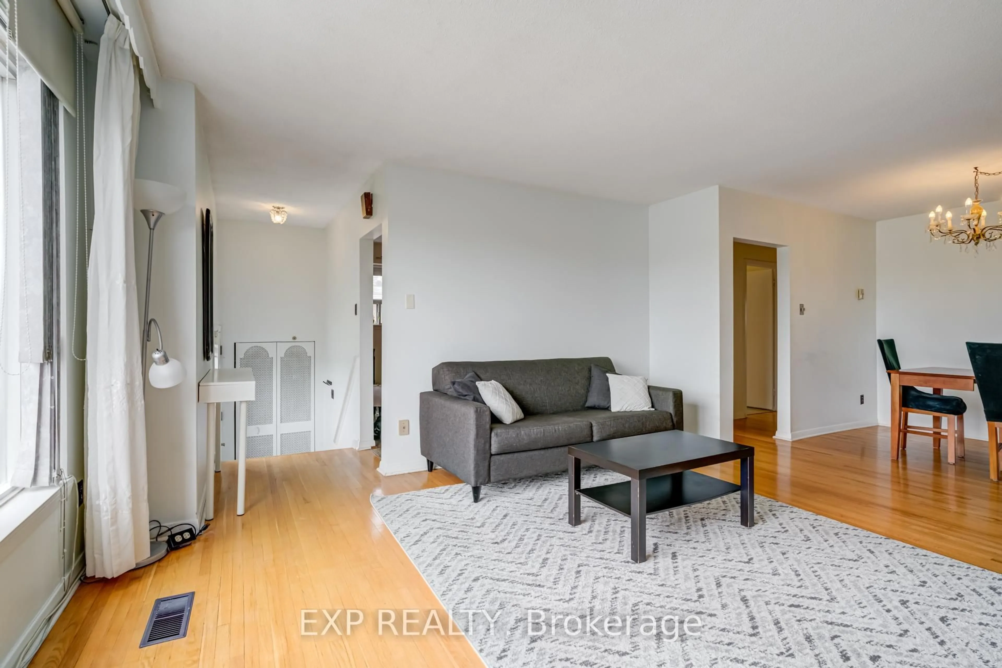 Living room with furniture, wood/laminate floor for 141 Grandravine Dr, Toronto Ontario M3J 1B3