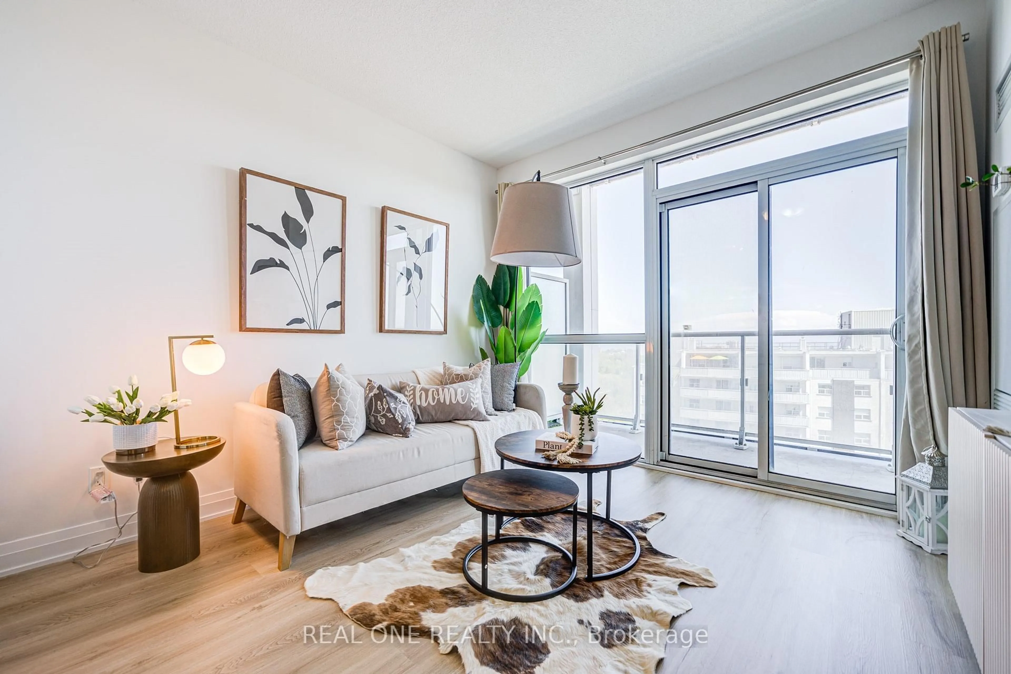 Living room with furniture, wood/laminate floor for 55 SPEERS Rd #1008, Oakville Ontario L6K 0H9
