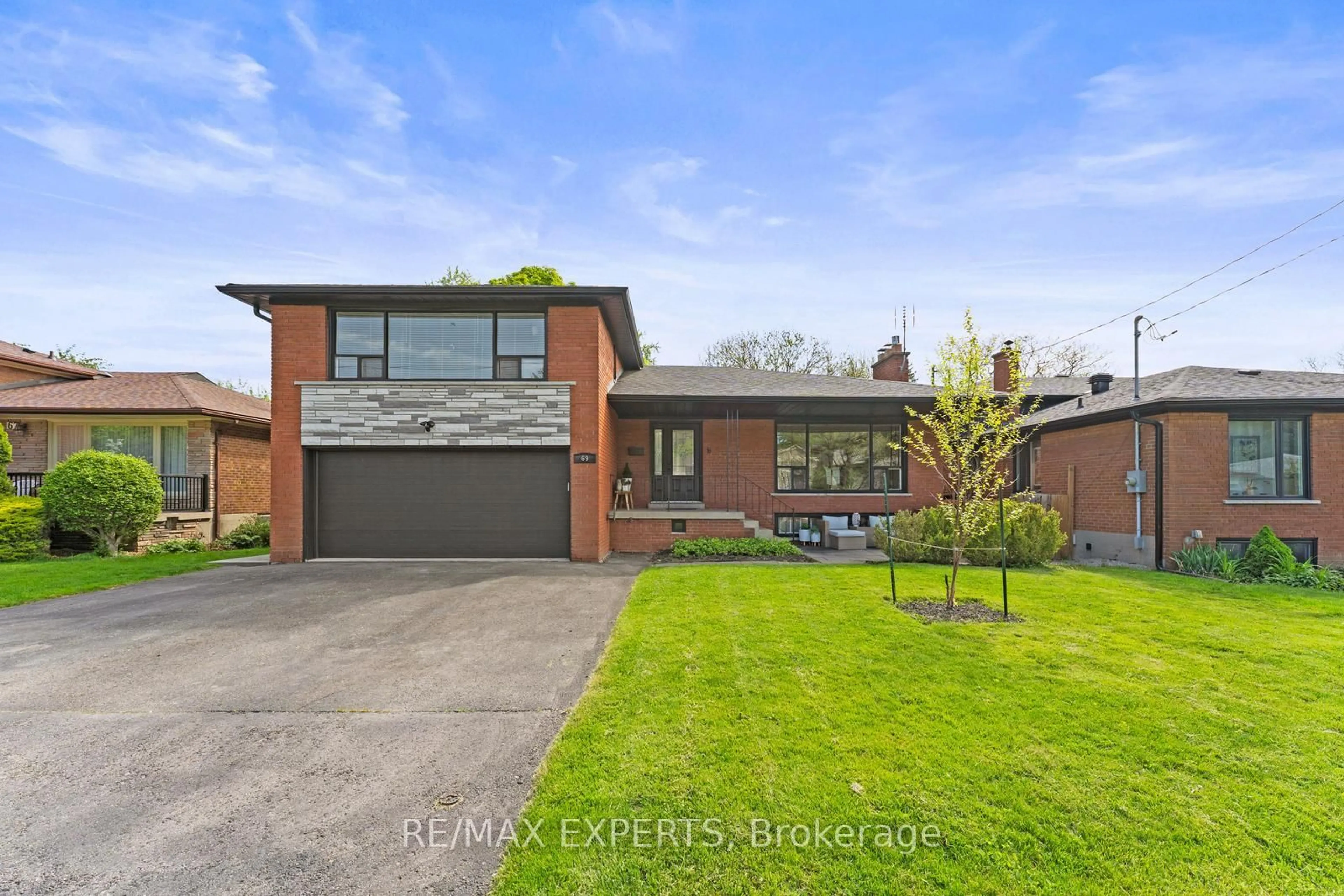 Home with brick exterior material, street for 69 Smithwood Dr, Toronto Ontario M9B 4S2