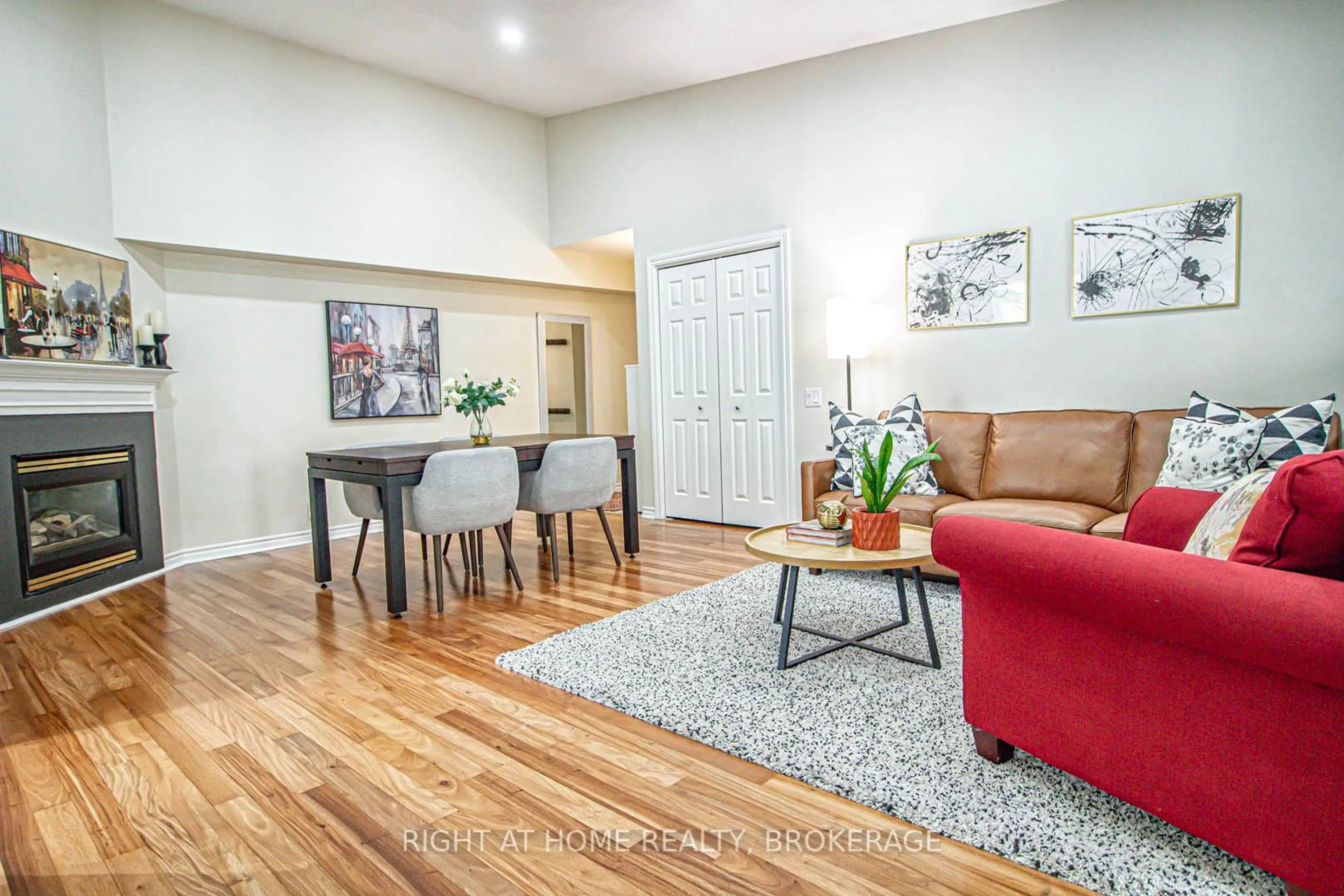 Living room with furniture, wood/laminate floor for 1451 Walker's Line #415, Burlington Ontario L7M 4P1
