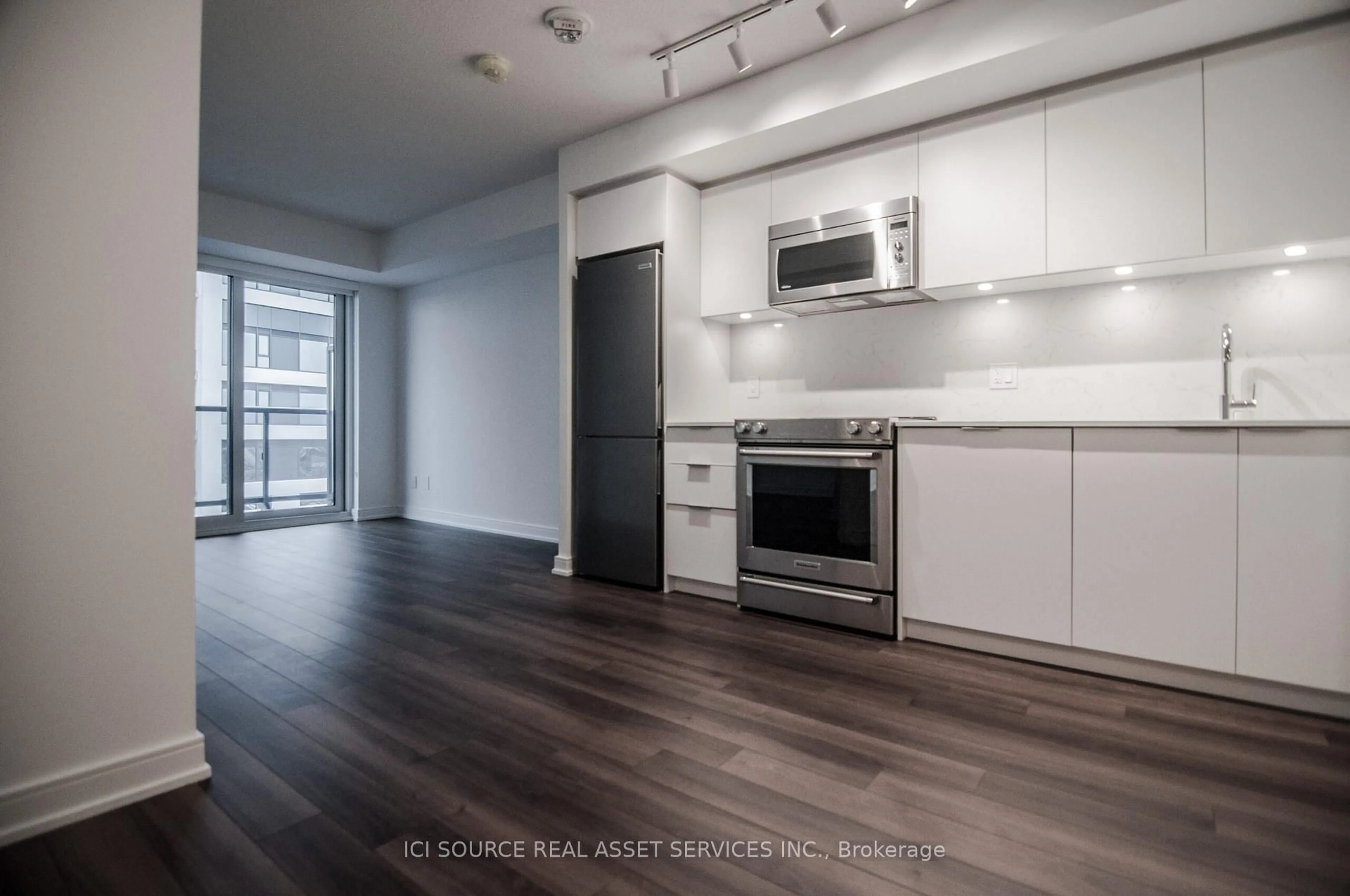 Open concept kitchen, wood/laminate floor for 30 Samuel Wood Way #1805, Toronto Ontario M9B 0C9