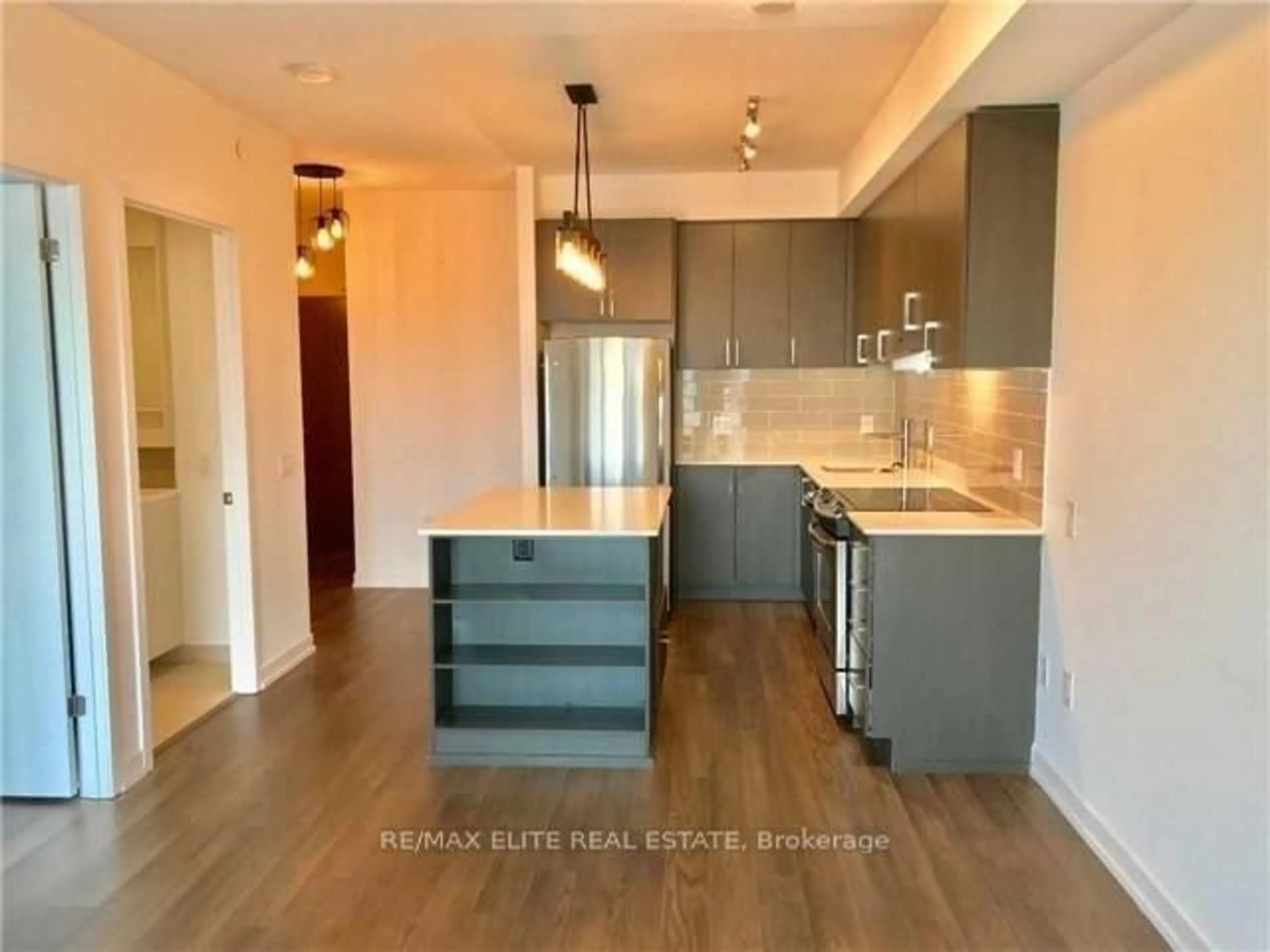 Open concept kitchen, wood/laminate floor for 2560 Eglinton Ave #908, Mississauga Ontario L5M 0Y3