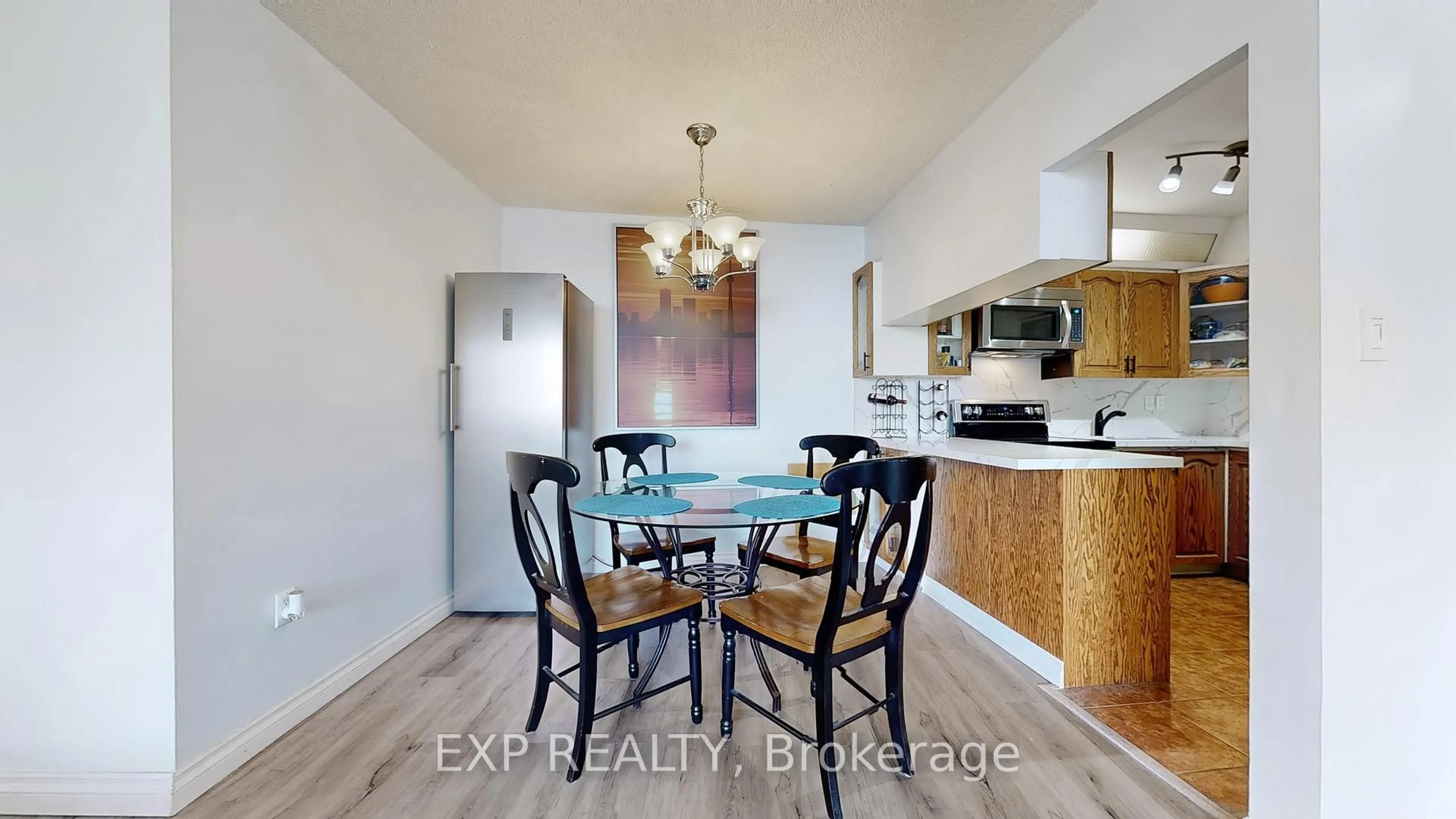 Dining room, wood/laminate floor for 330 Dixon Rd #1007, Toronto Ontario M9R 1S9