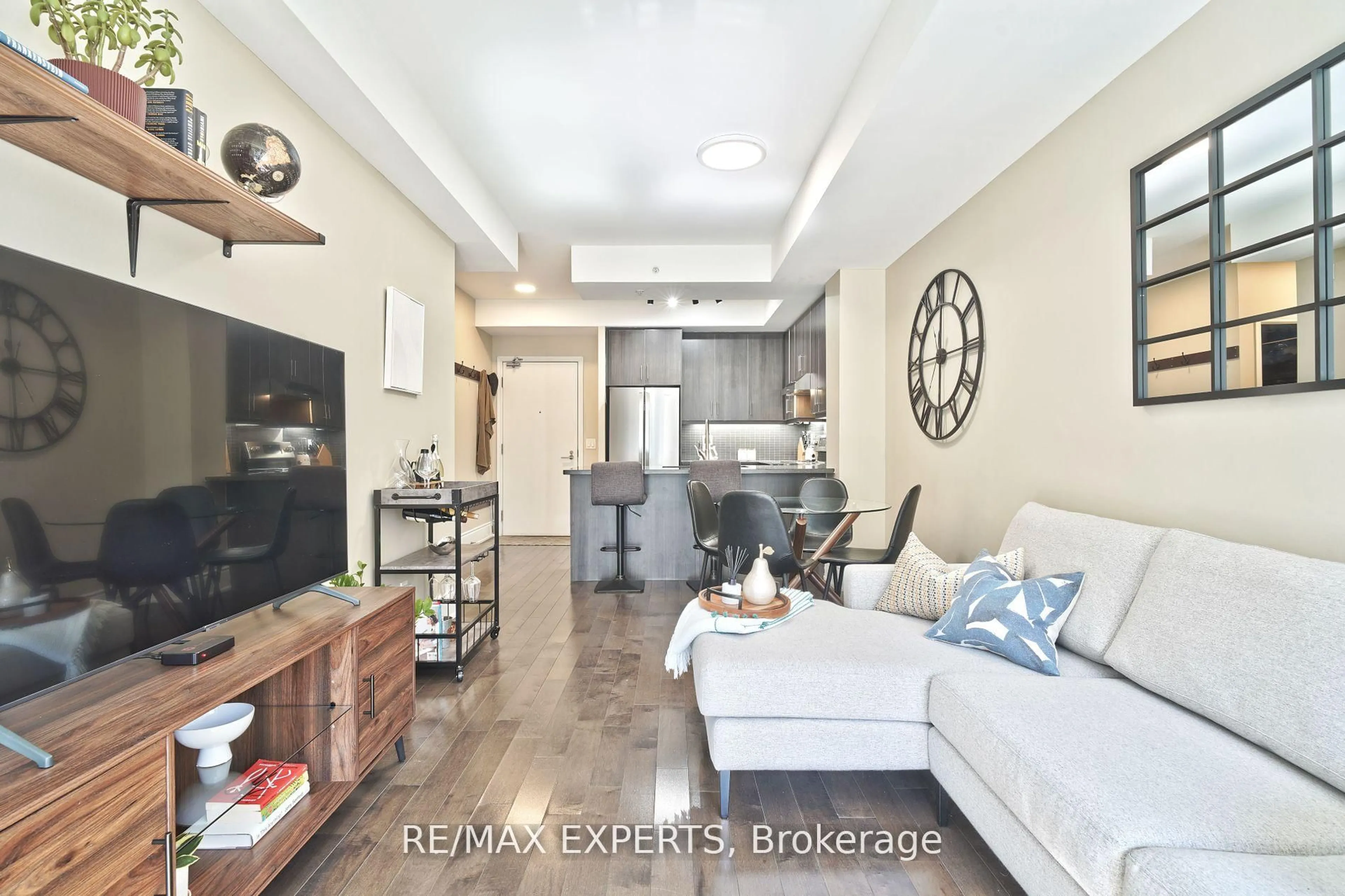 Living room with furniture, unknown for 15 James Finlay Way #1017, Toronto Ontario M3M 0A2