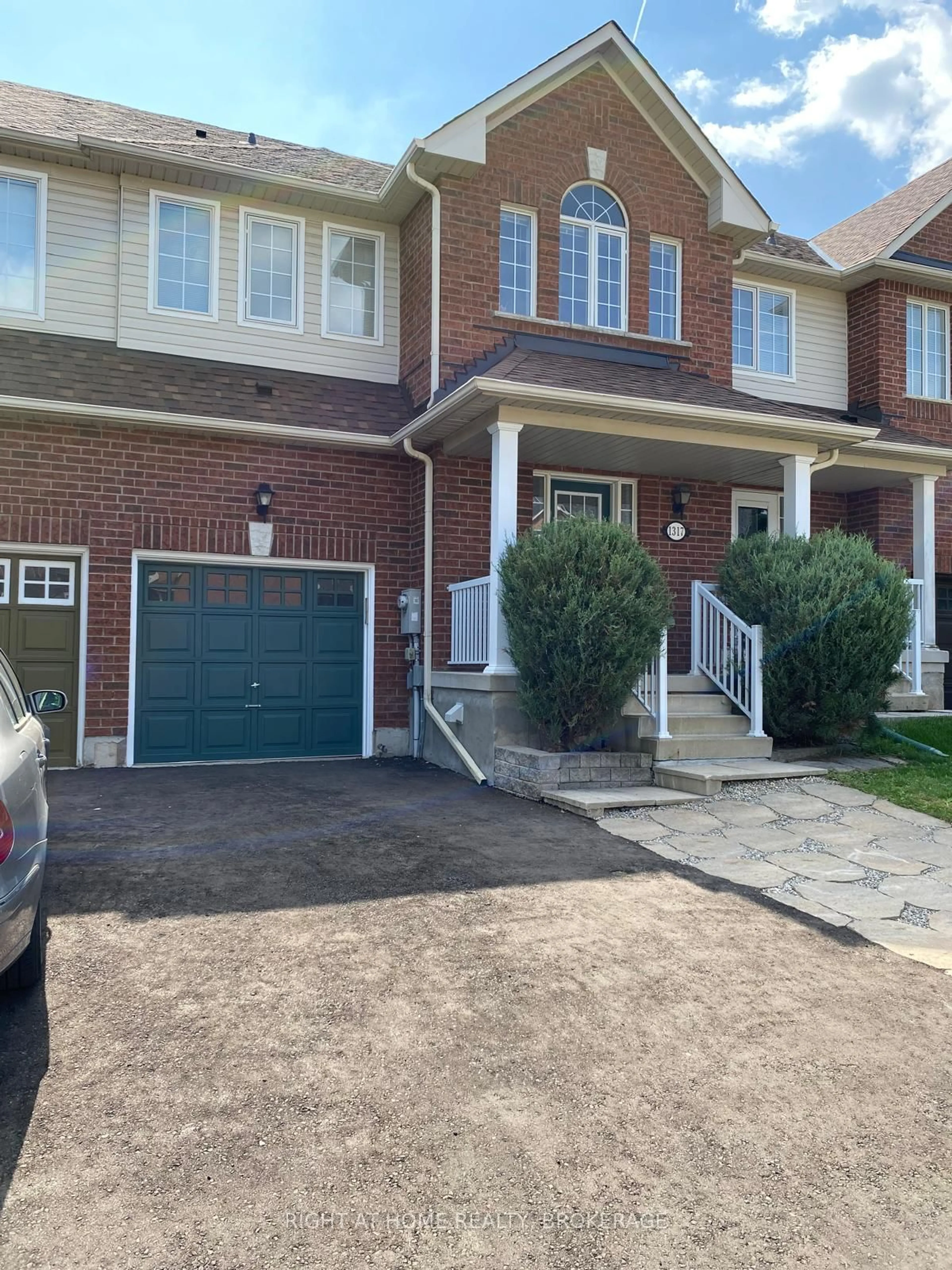 Home with brick exterior material, street for 1317 Cartmer Way, Milton Ontario L9T 6J9