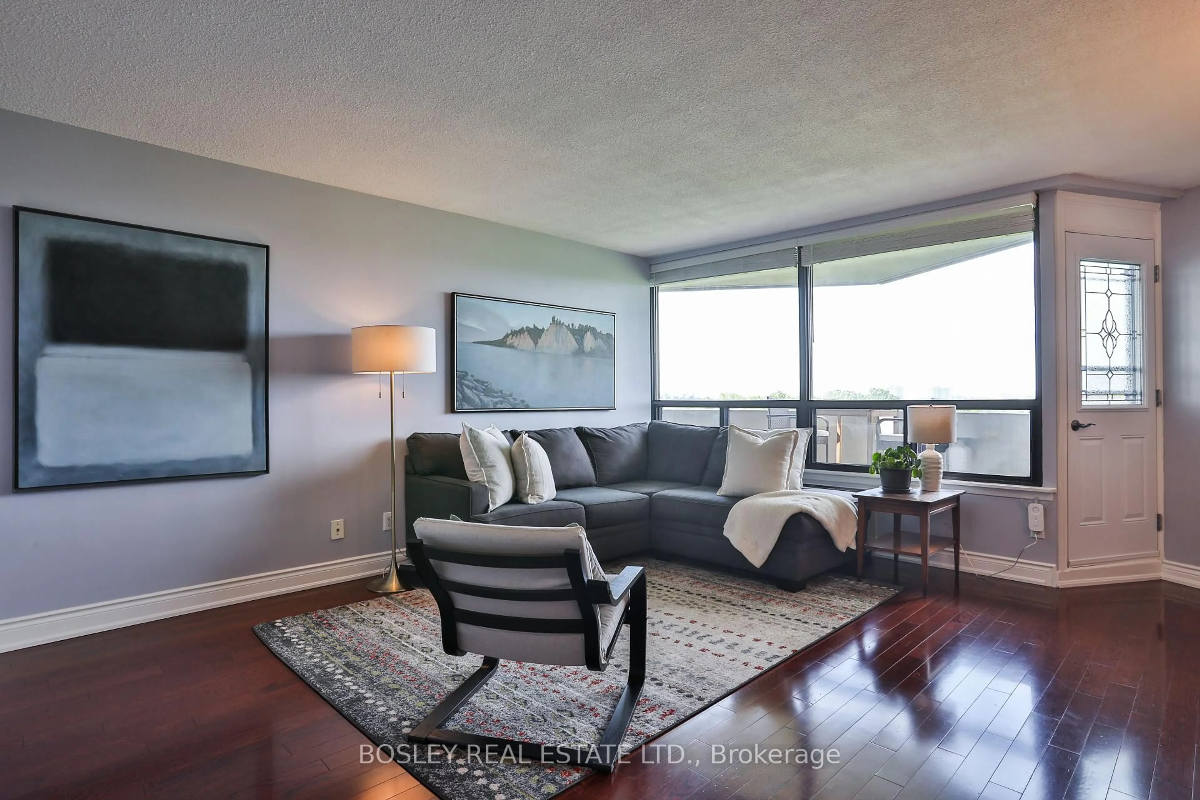 Living room with furniture, wood/laminate floor for 284 Mill Rd #C15, Toronto Ontario M9C 4W6