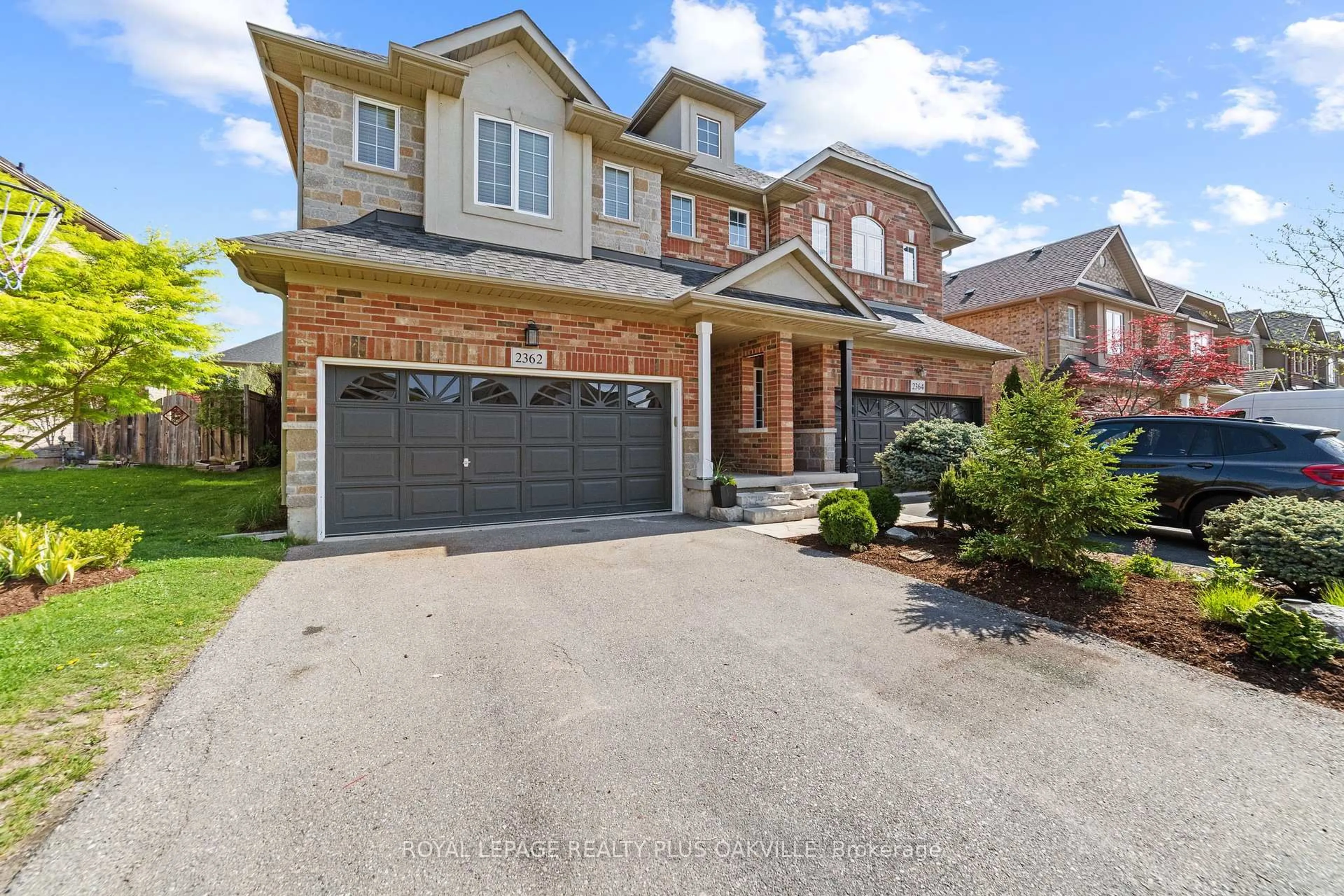 Home with brick exterior material, street for 2362 Stone Glen Cres, Oakville Ontario L6M 0C7