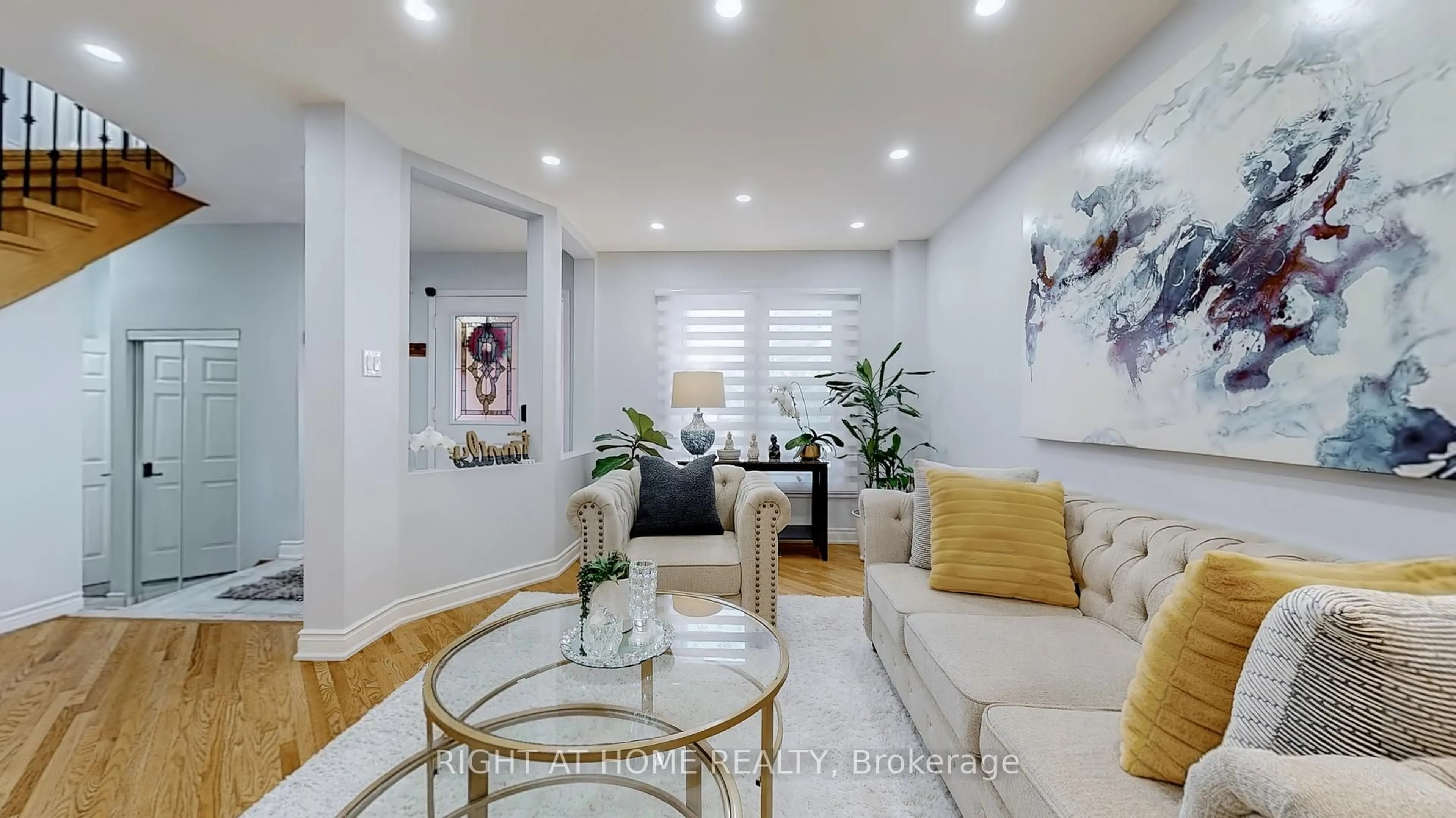 Living room with furniture, wood/laminate floor for 5253 Floral Hill Cres, Mississauga Ontario L5V 1V4