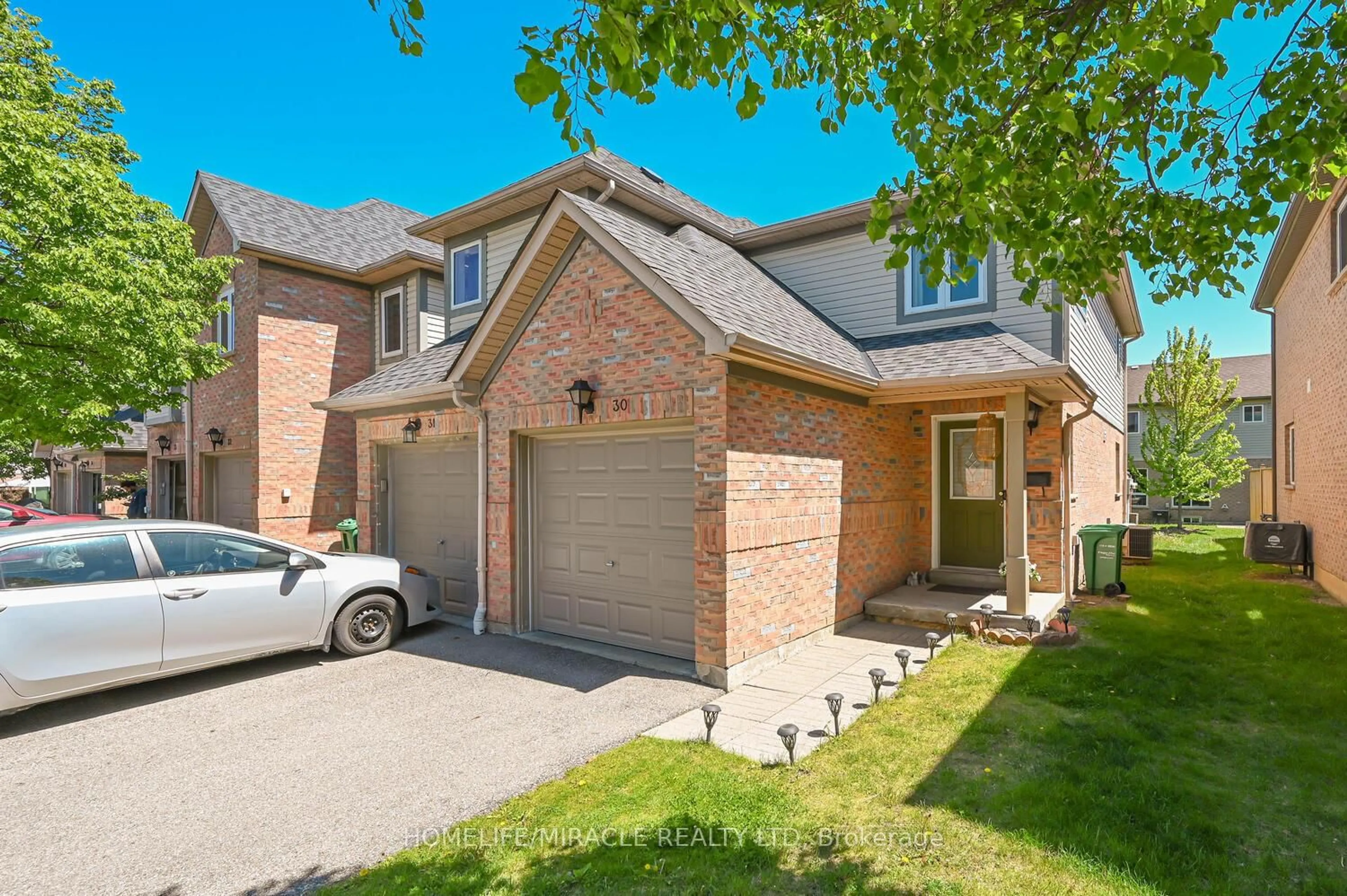 Home with brick exterior material, street for 5255 Guildwood Way ##30, Mississauga Ontario L5R 4A9