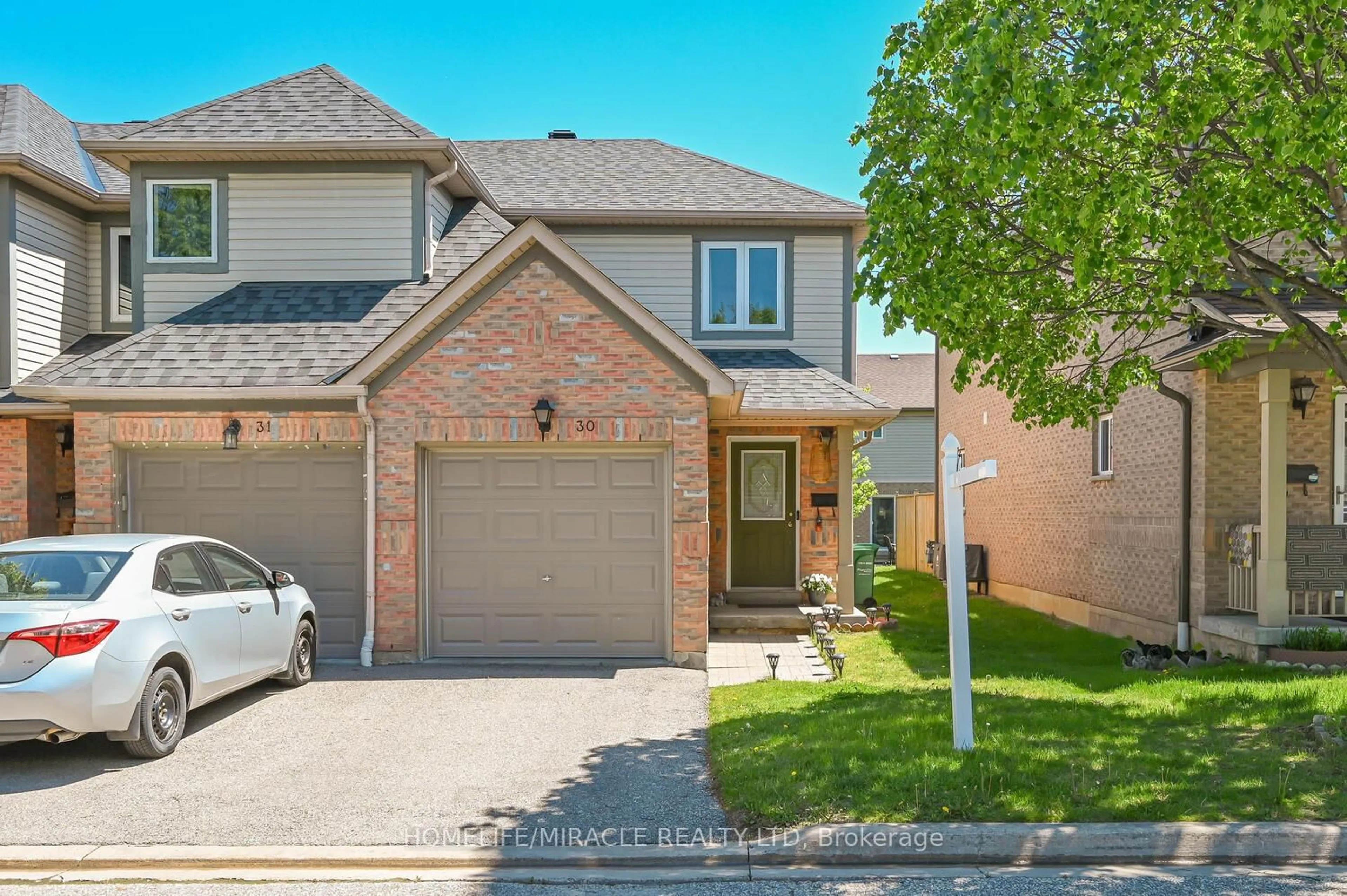 Home with brick exterior material, street for 5255 Guildwood Way ##30, Mississauga Ontario L5R 4A9