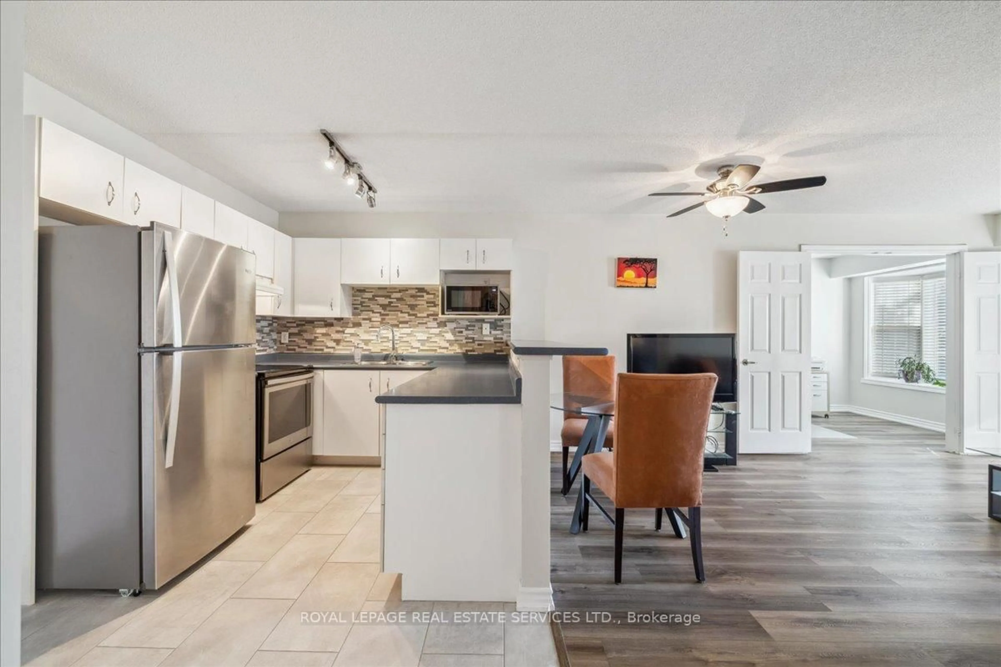 Open concept kitchen, ceramic/tile floor for 1441 Walkers Line #209, Burlington Ontario L7M 4P2