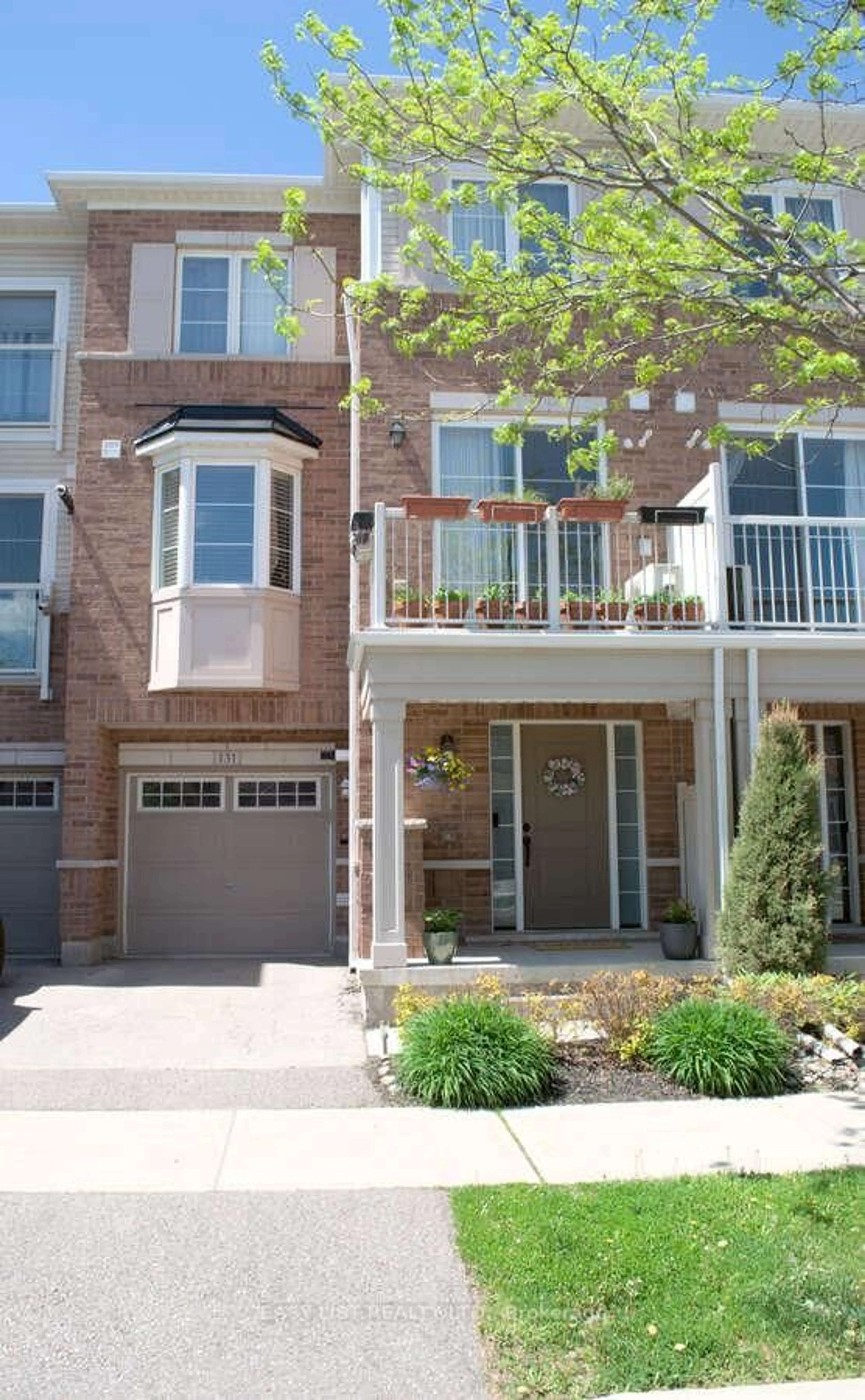 Home with brick exterior material, street for 165 Hampshire Way #131, Milton Ontario L9T 8M7