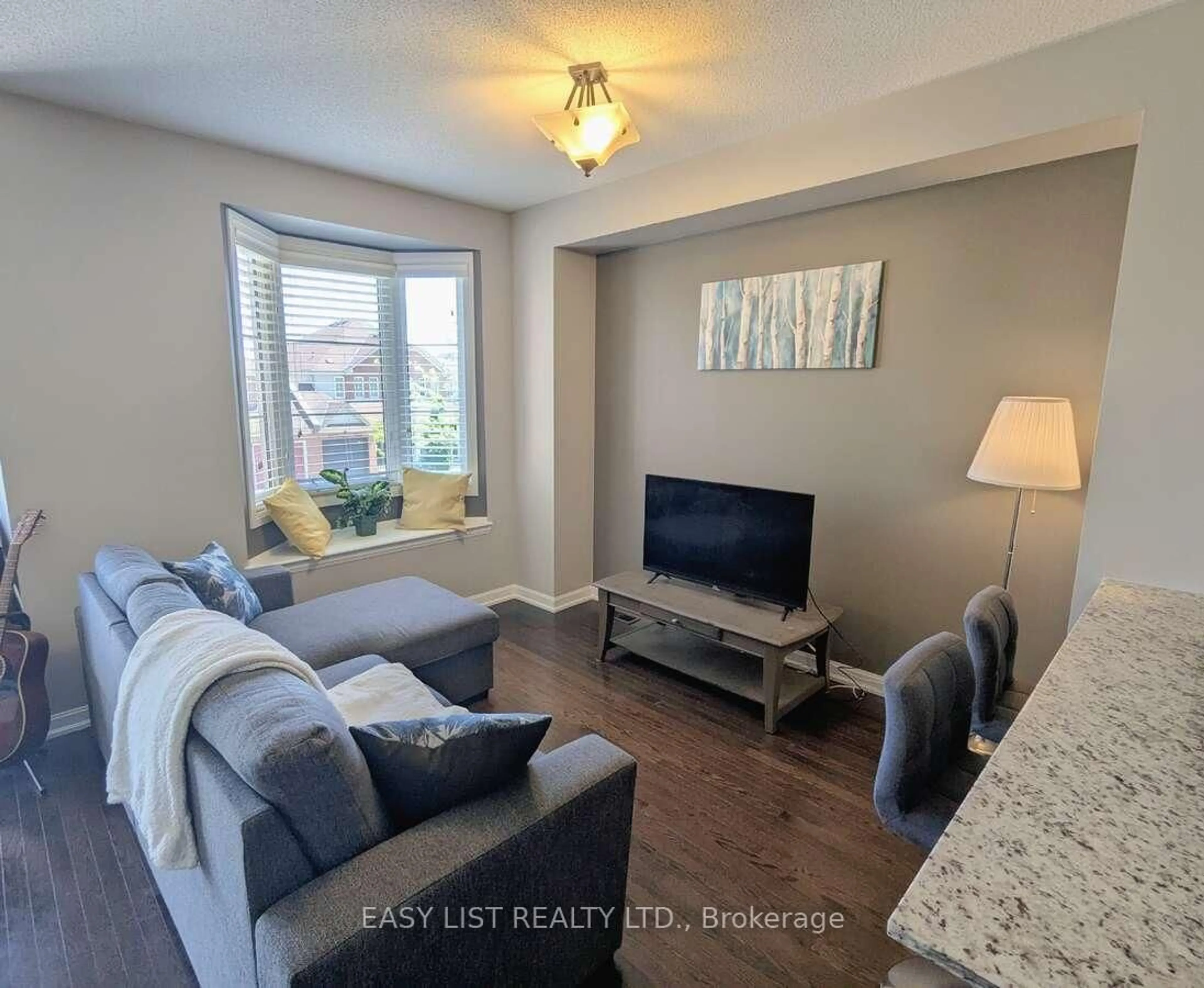 Living room with furniture, unknown for 165 Hampshire Way #131, Milton Ontario L9T 8M7