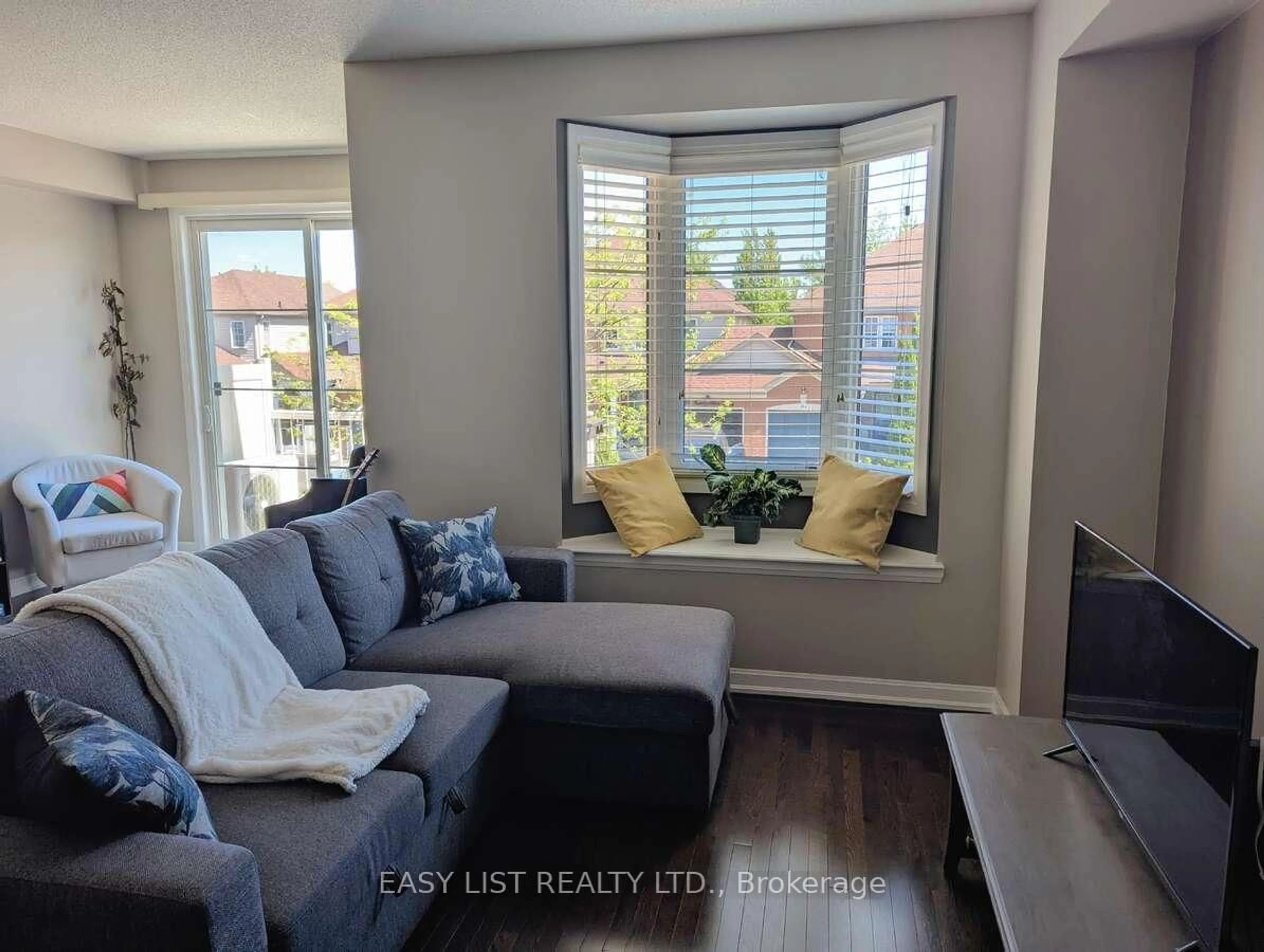 Living room with furniture, unknown for 165 Hampshire Way #131, Milton Ontario L9T 8M7