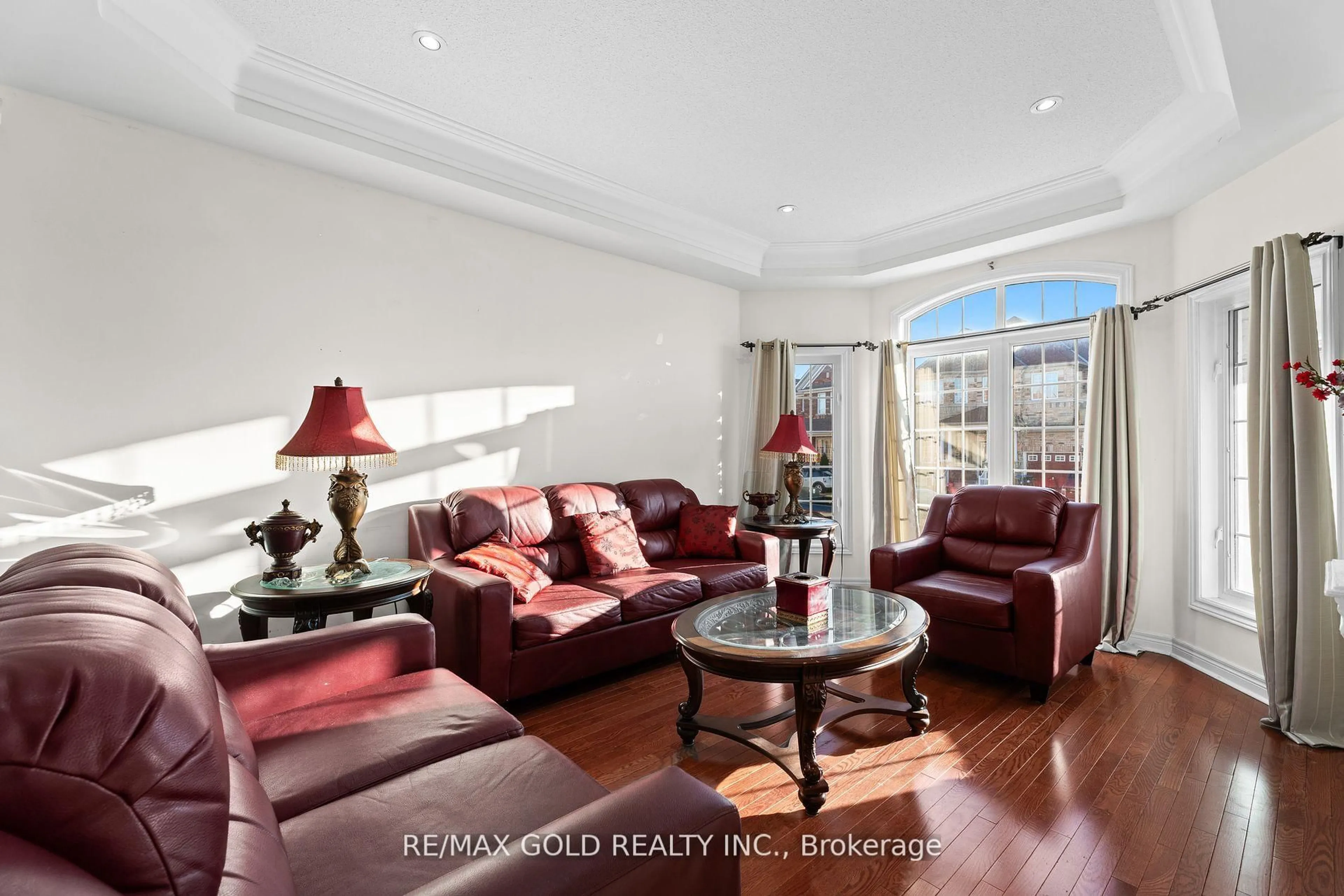 Living room with furniture, wood/laminate floor for 57 Powell Dr, Brampton Ontario L6R 0K8