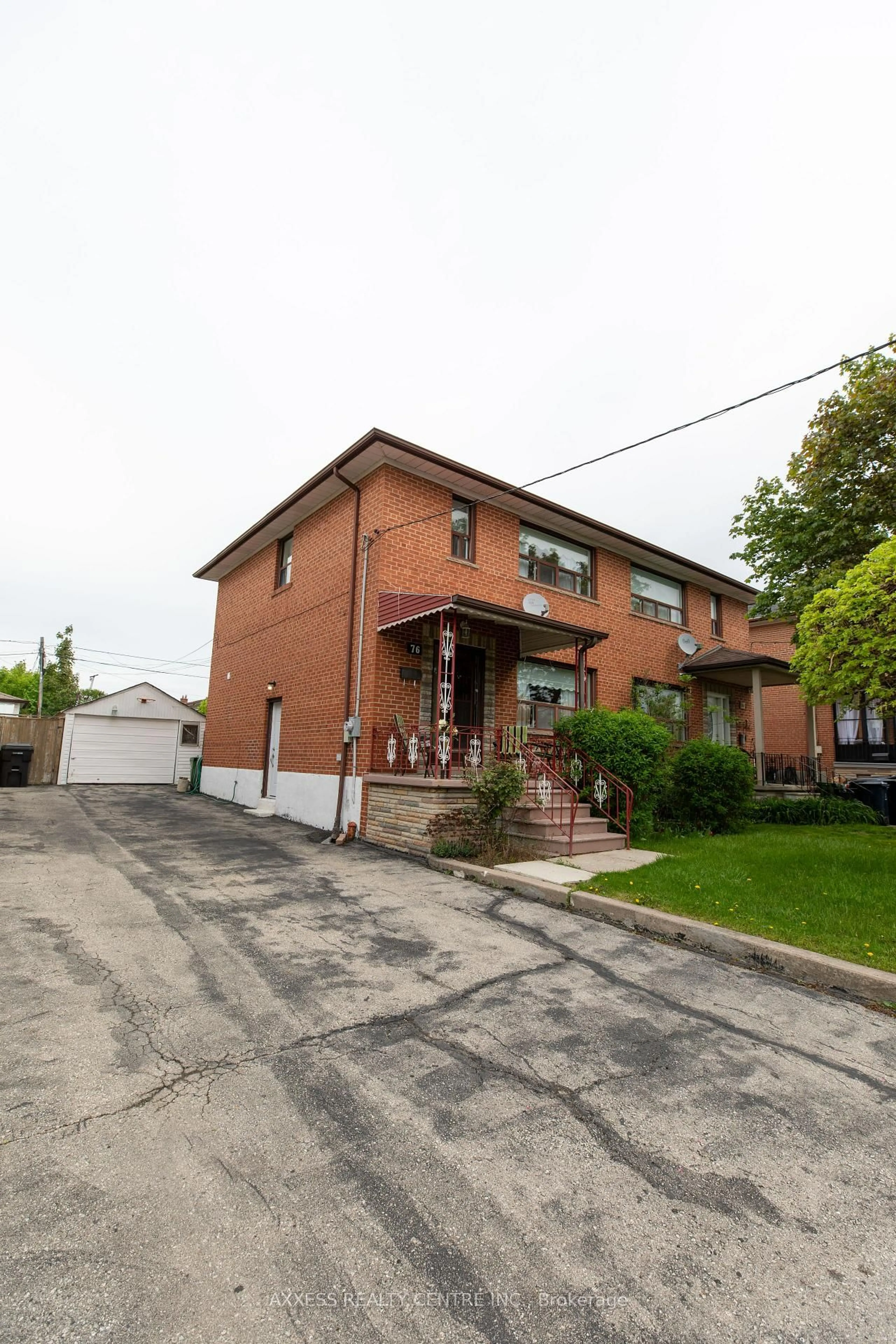 Home with brick exterior material, street for 76 Dombey Rd, Toronto Ontario M3L 1P2