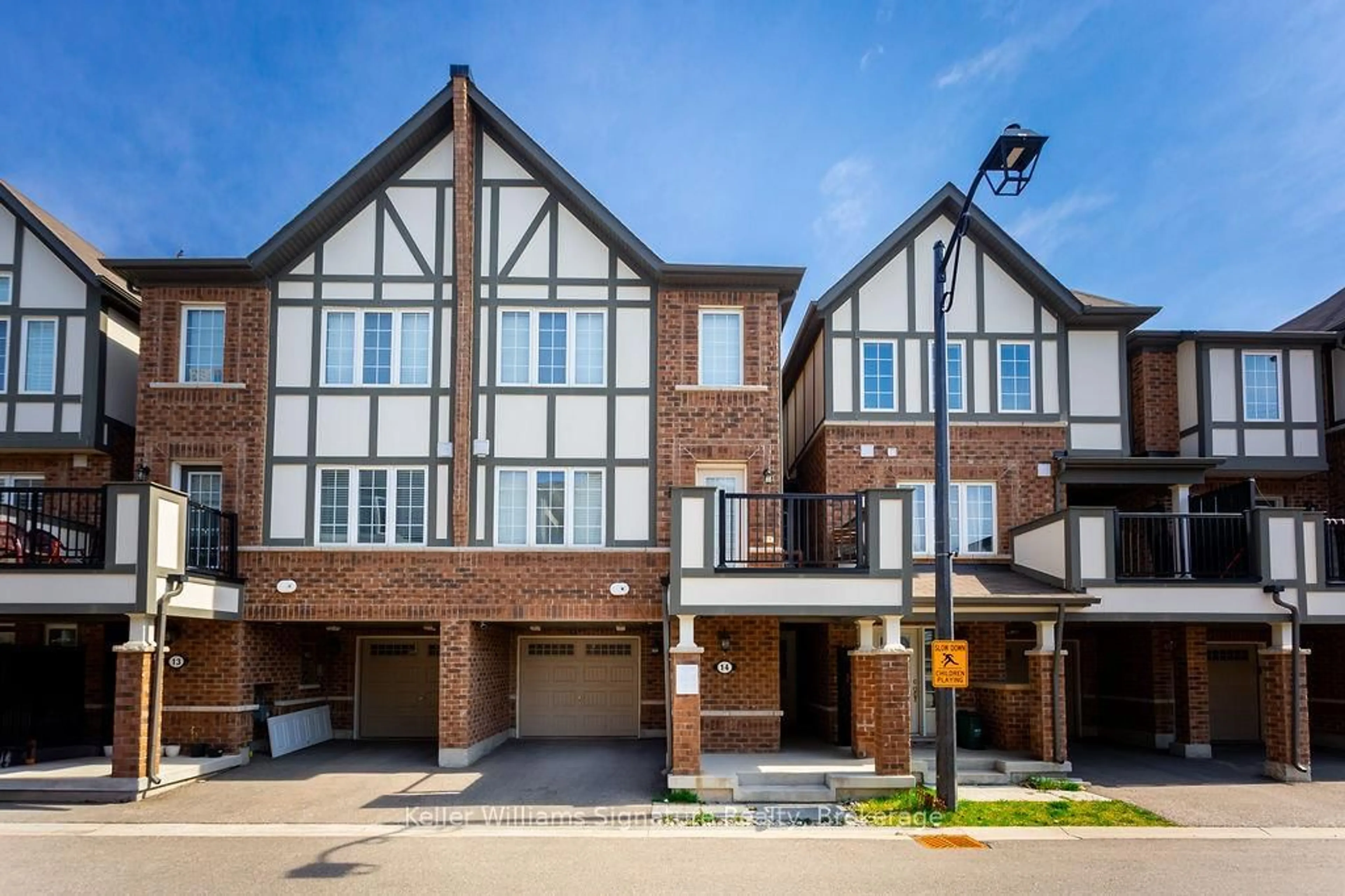 Home with brick exterior material, street for 1222 Rose Way #14, Milton Ontario L9E 1P2