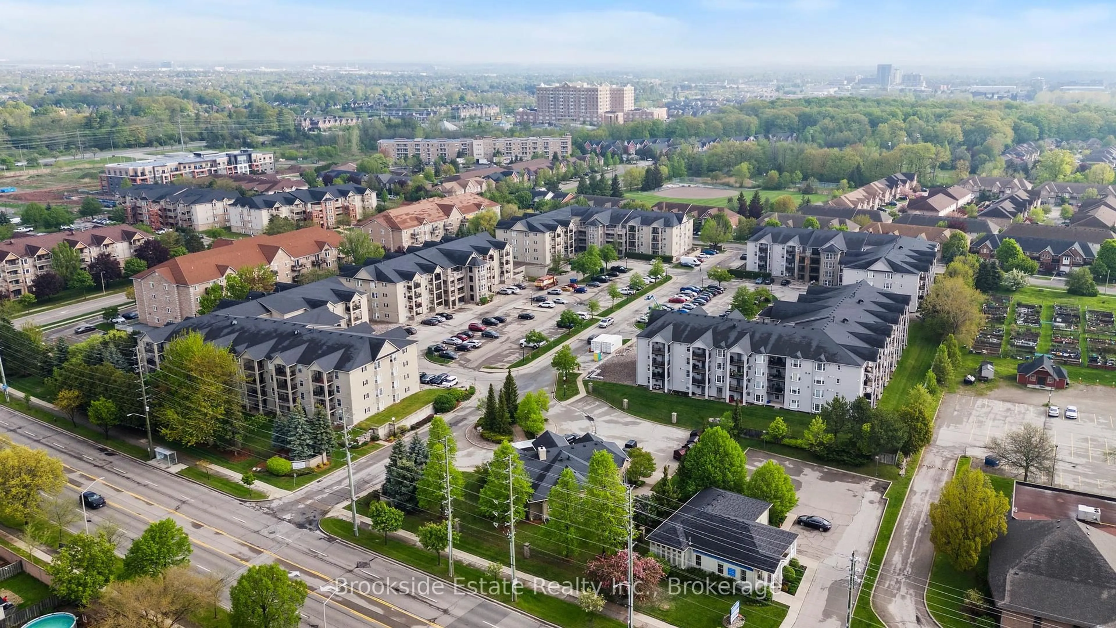 A pic from outside/outdoor area/front of a property/back of a property/a pic from drone, city buildings view from balcony for 1431 Walkers Line #103, Burlington Ontario L7M 4P3
