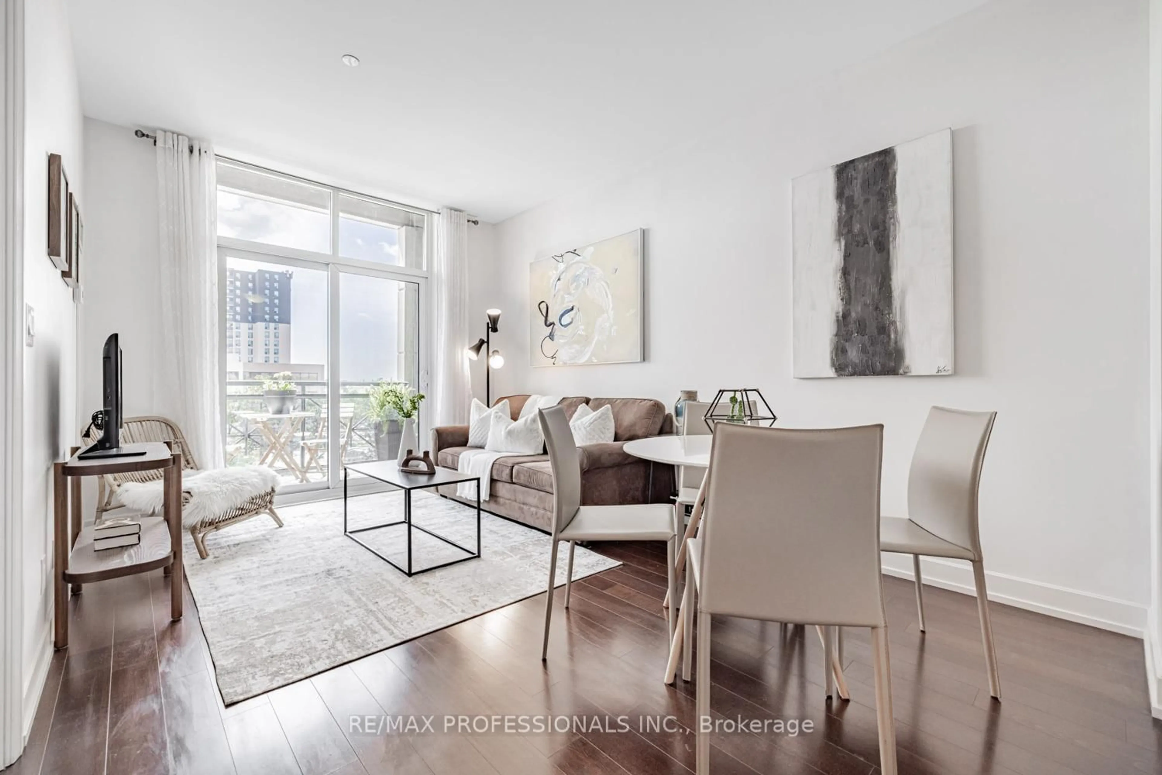 Living room with furniture, unknown for 6 Eva Rd #205, Toronto Ontario M9C 0B1