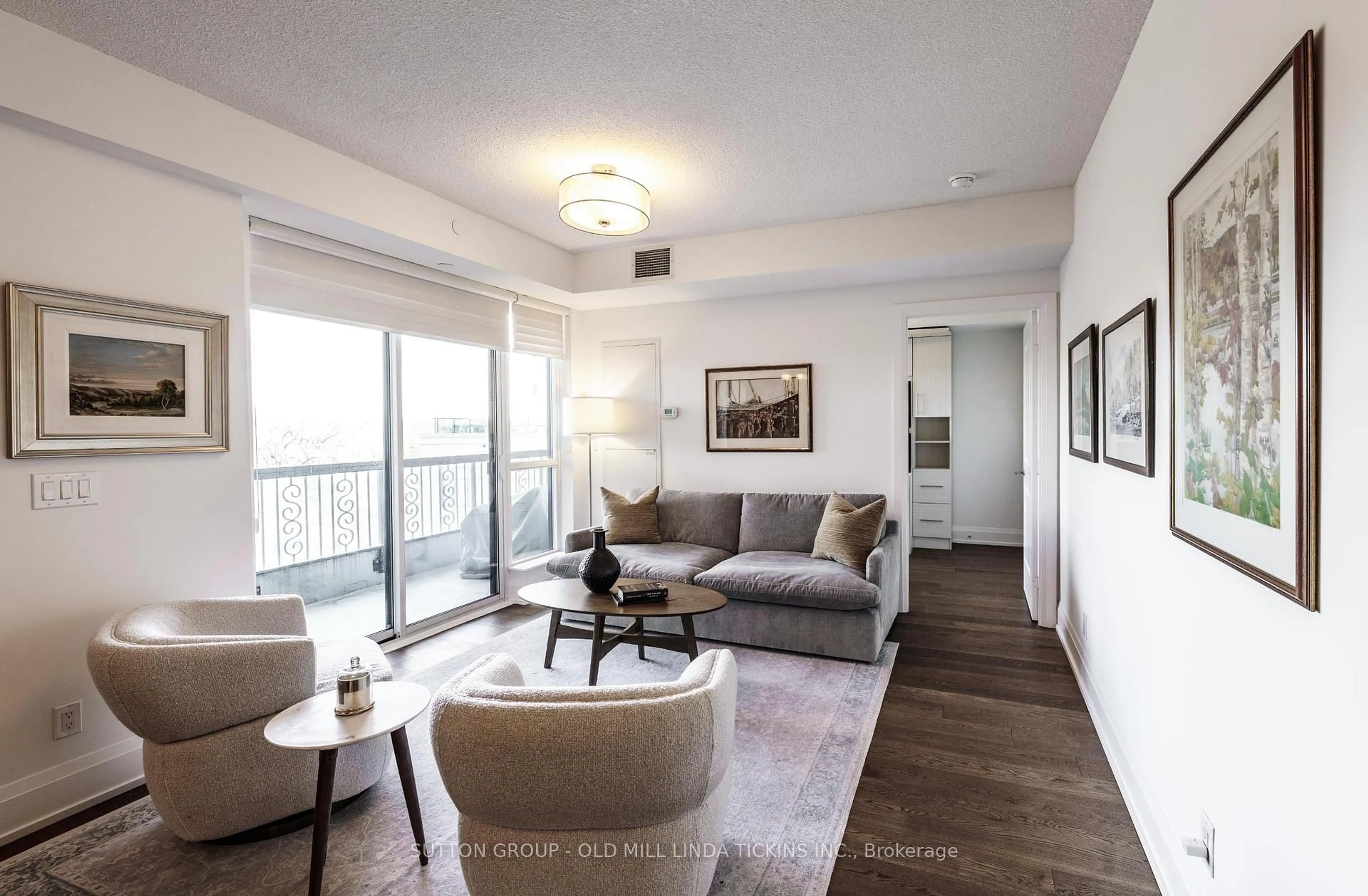 Living room with furniture, wood/laminate floor for 1 Old Mill Dr #927, Toronto Ontario M6S 0A1